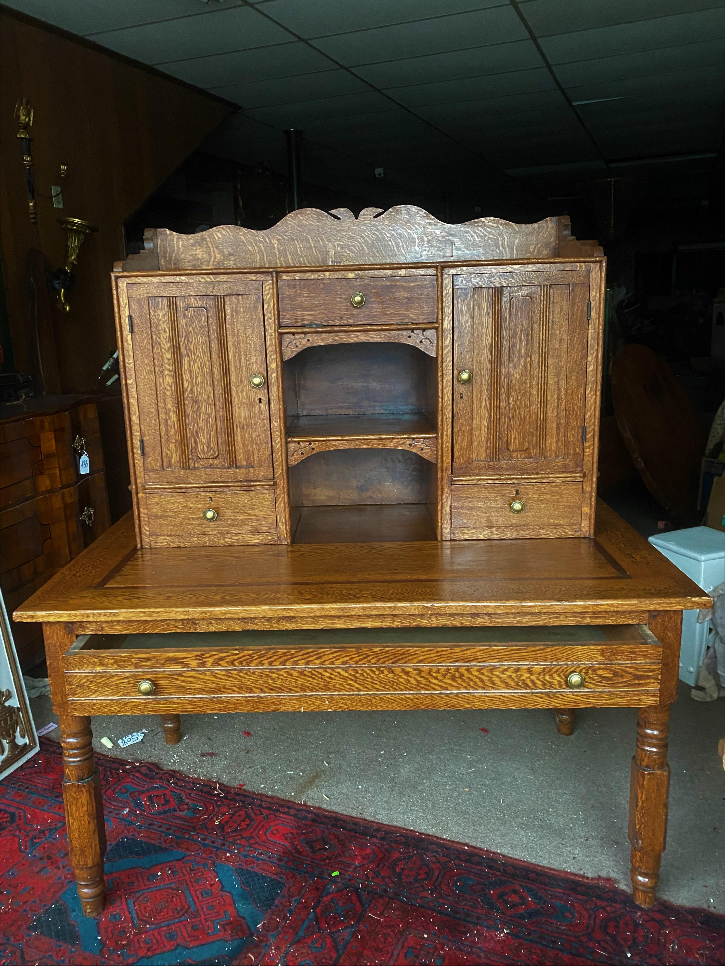 This is a great looking antique desk with plenty of organizing space and storage but there is enough room to work on a laptop. The top is a separate piece and can be removed leaving a flat top desk which has an inlayed boarder but the place where