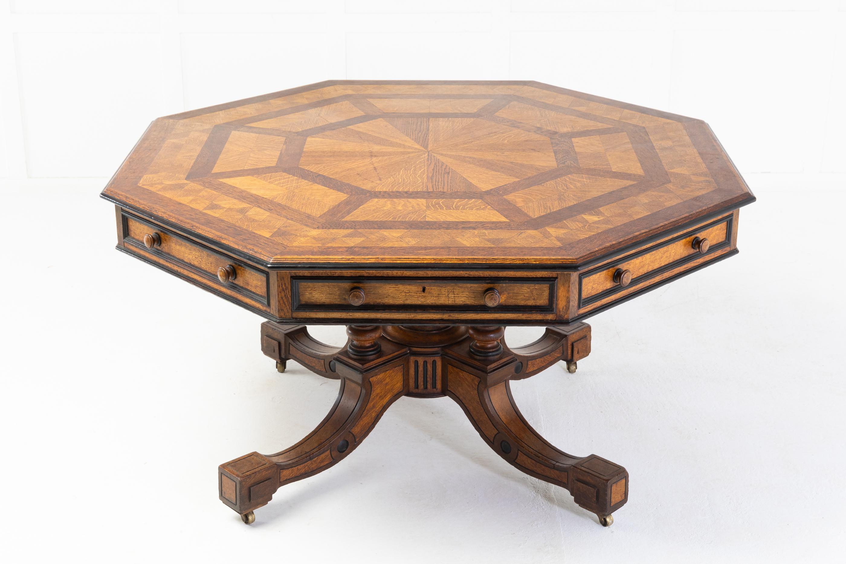 A wonderful large scale, and very elegant 19th century octagonal drum or library table by Howard and Sons. Having a wonderful parquetry top made from different shades of oak timber. Having Hobbs locks on each of the four drawers that open. Four