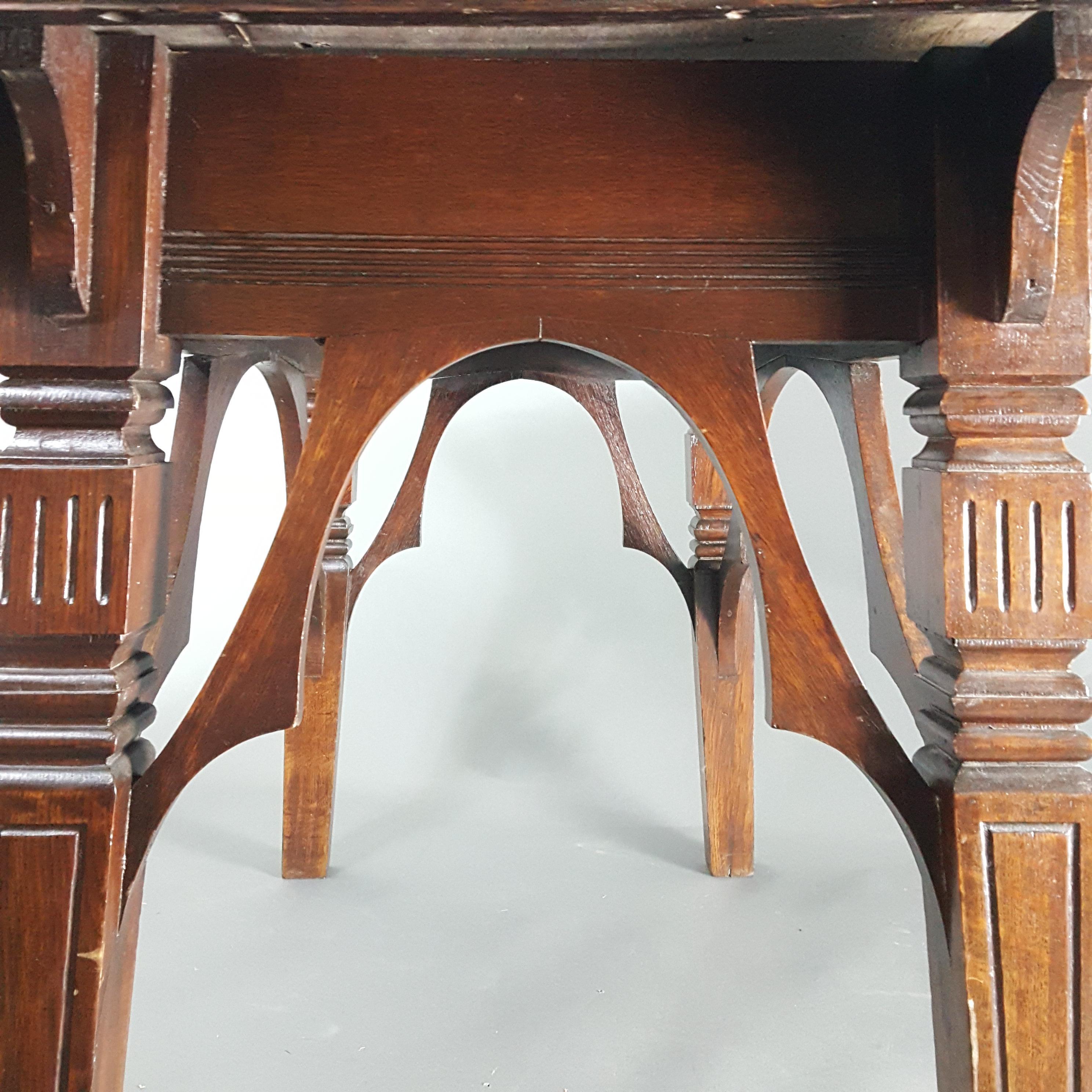 Rare 19th Century oak side table attributed to Dr Christopher Dresser, or his studio,  for the cabinet maker Thomas Knight of Bath. The strecther arrangement on the table is highly unusual and relates to a chair design that dresser supplied to