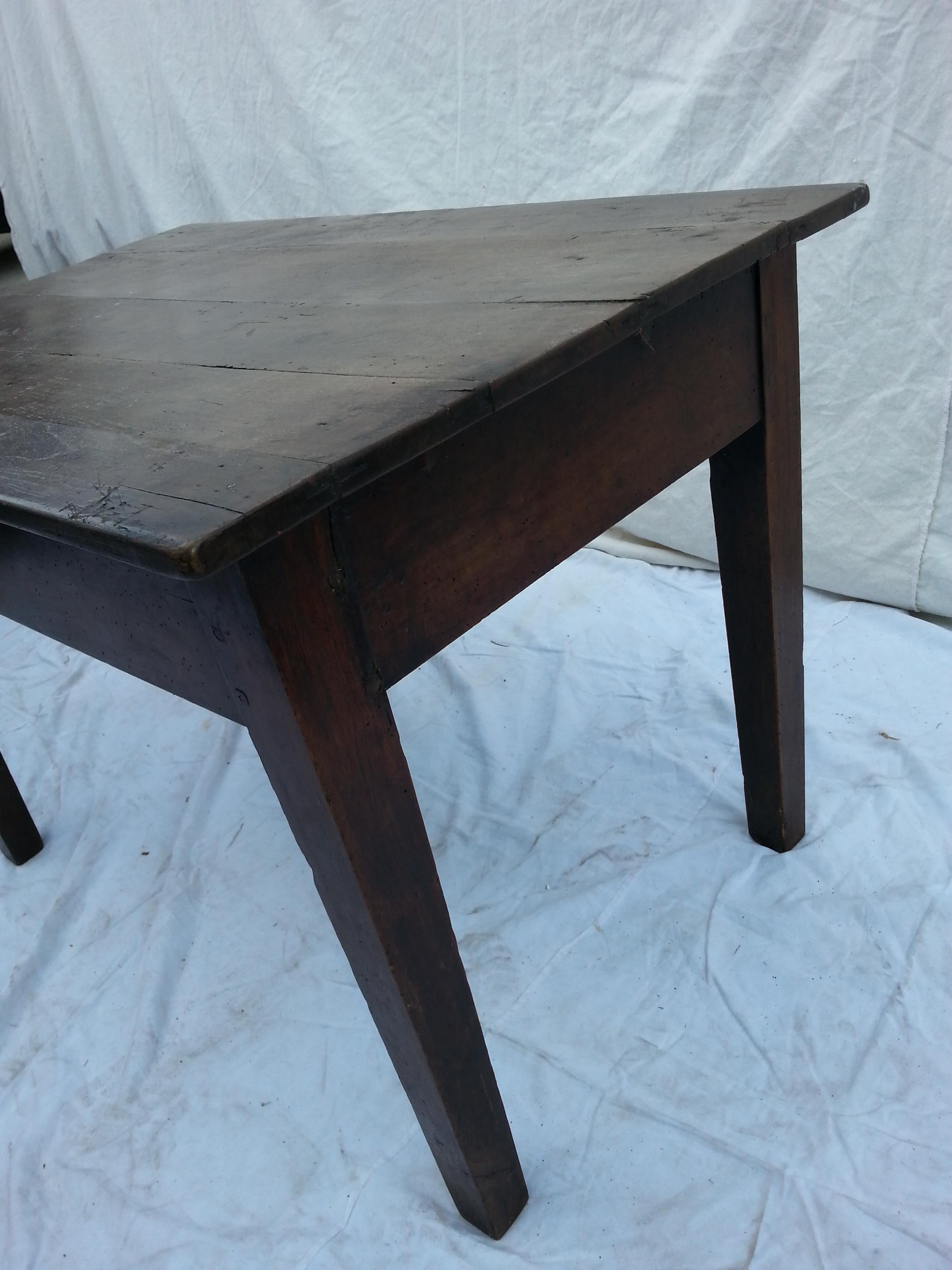 19th Century oak side table with walnut dark stain and straight legs. The top face of the table is made of five joined oak slats and wears expected scuffing and signs of use. Structurally sound and ready for a home.
 