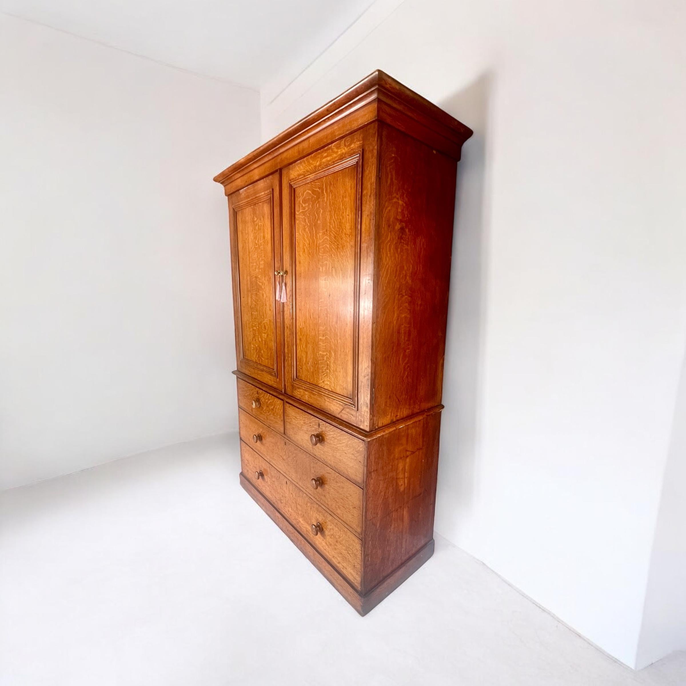 A 19th Century Light Oak Wardrobe / Linen Press or Housekeeper’s Cupboard.

A beautiful and substantial 19th-century oak wardrobe or linen press, boasting a fantastic colour and classic design. This elegant piece splits in half for ease of transport
