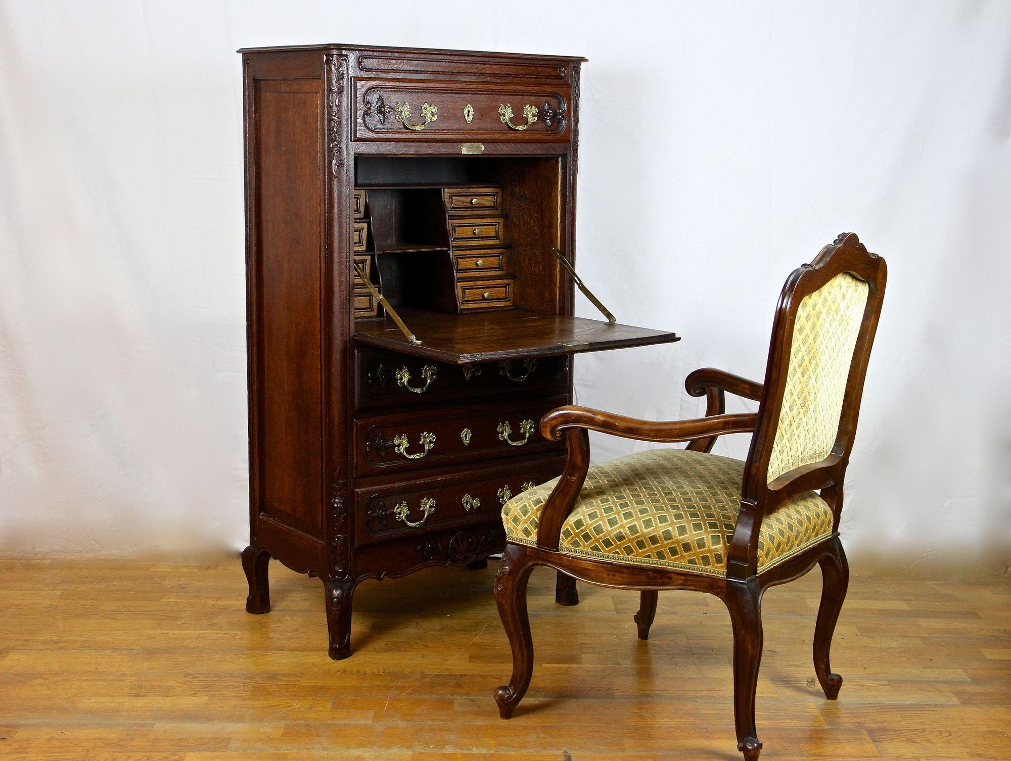 Extraordinary hand-carved oakwood secretary cabinet from the Baroque revival period in Austria. A real unique, perfect sized bureau cabinet/ secretary made of solid oakwood and stained to a very beautiful dark nutwood tone. This secretary cabinet