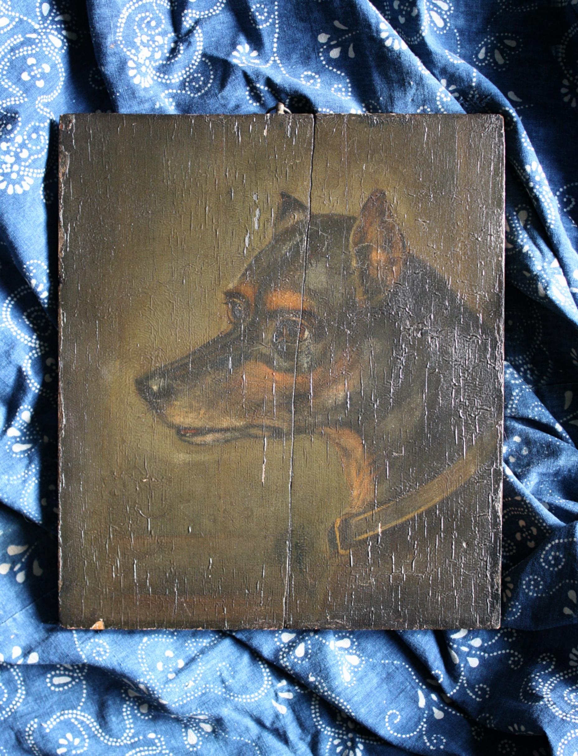 An imposing dark and moody depiction of A English Toy Terrier, oil on board. 

The painted surface has a decorative texture, some minor losses. An elderly spilt in the board has been repaired (two wooden straps on back),

circa 1880, measures: