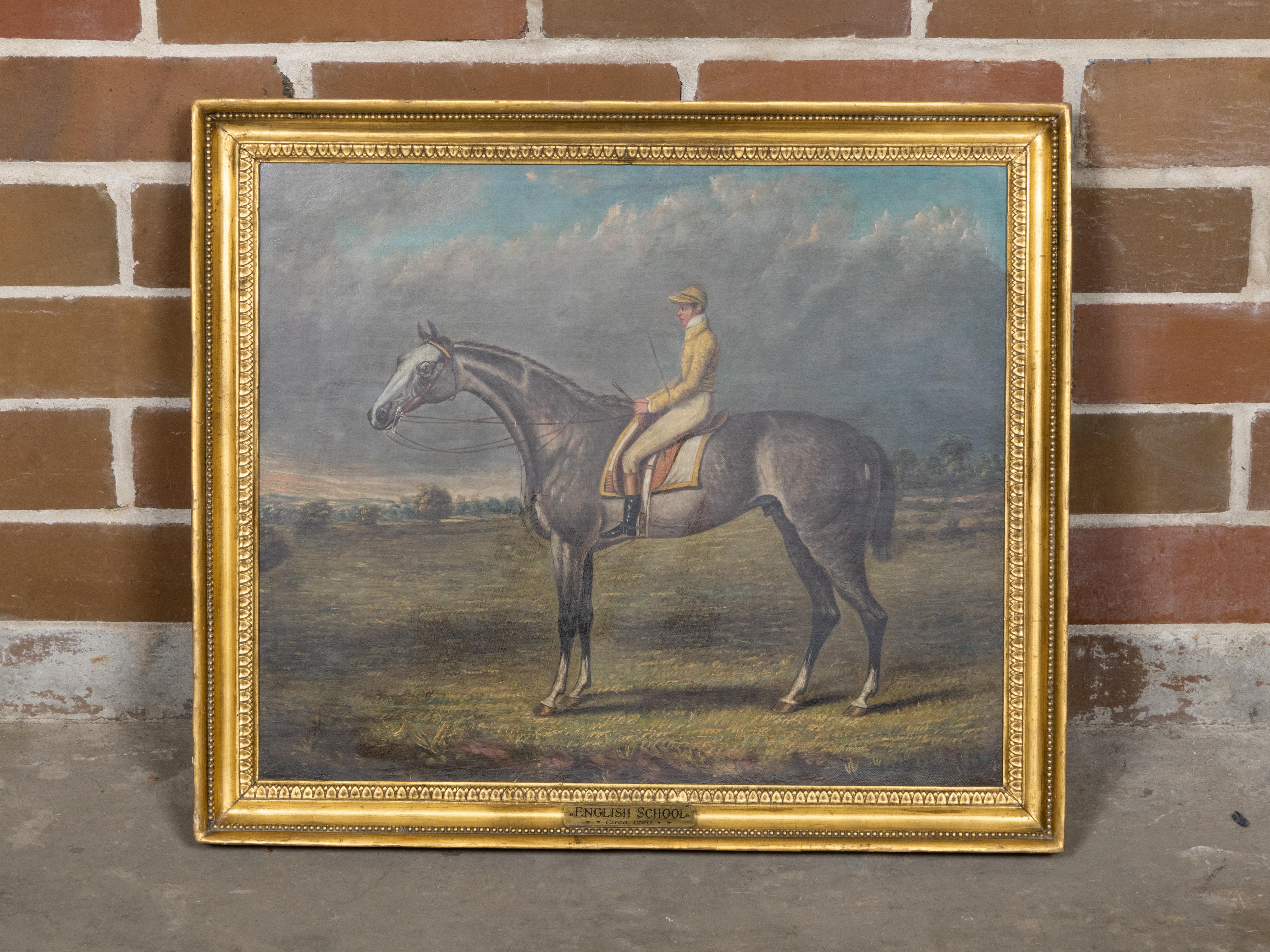 Dipinto inglese del 18° secolo a olio su tela raffigurante un cavallo e un fantino, con cornice in legno dorato intagliato. Questo olio su tela inglese del XVIII secolo raffigura un cavallo e un fantino in un profilo sereno e dinamico. Il cavallo