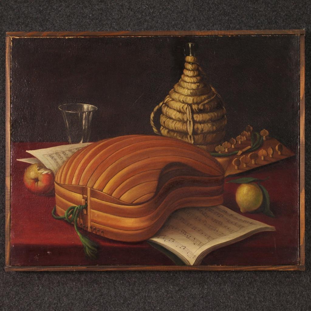 Antique Italian painting from the 19th century. Artwork oil on canvas, on the first canvas, depicting still life with musical instrument, score, fruit and wine flask of good pictorial quality. Painting of nice size and excellent proportion ideal to