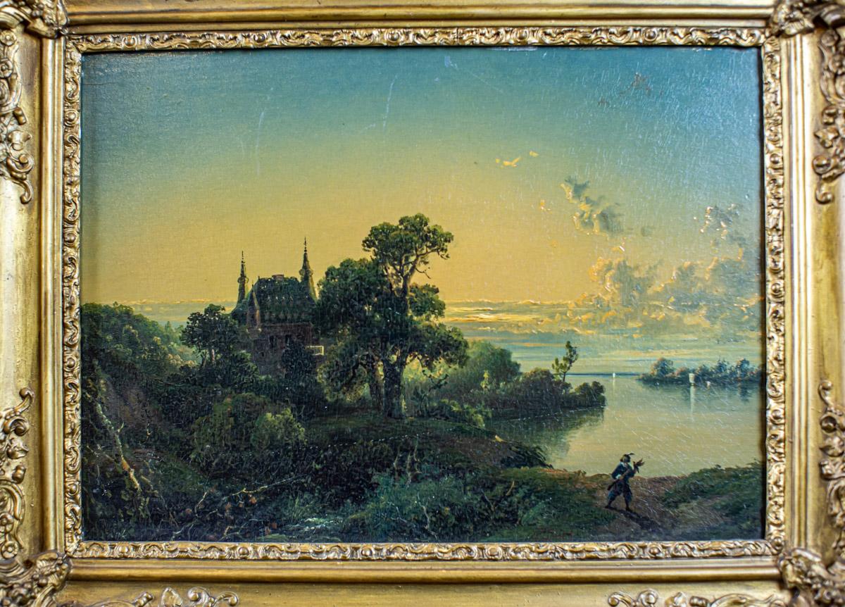 19th-Century Oil on Hardboard Depicting Nature in Gold Frame

We present you an oil painting on hardboard from Q4 of the 19th century.
The landscape with staffage depicts a view of a lake. The signature is illegible.

This painting is one of the two
