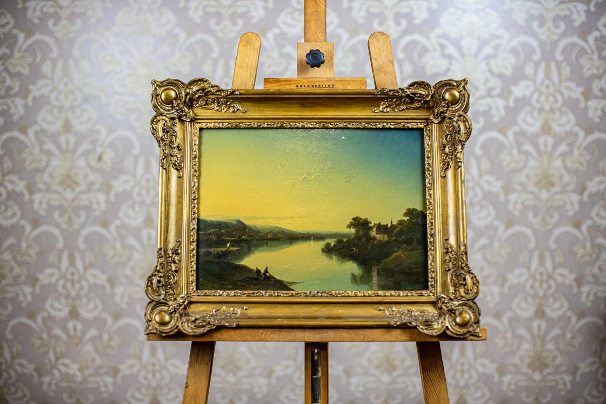 19th-Century Oil on Hardboard Depicting River in Gold Frame

We present you an oil painting on hardboard from Q4 of the 19th century.
The signature is illegible.

This painting is one of the two landscapes from the set in the same frame.
The other