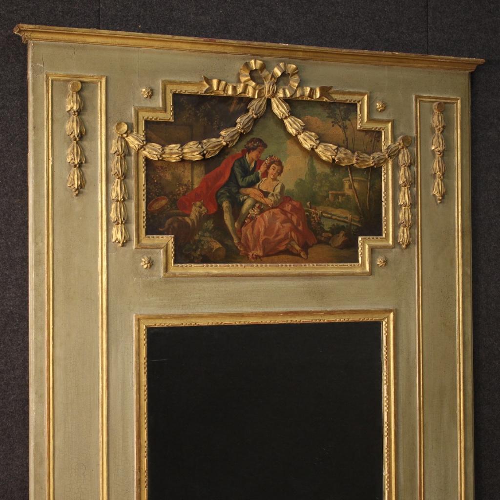French mirror with painting, trumeau from the late 19th century. Furniture in carved, lacquered and gilded wood in Louis XVI style complete with mirror and moulding adorned with painting (oil on panel). Framework depicting a romantic style scene of