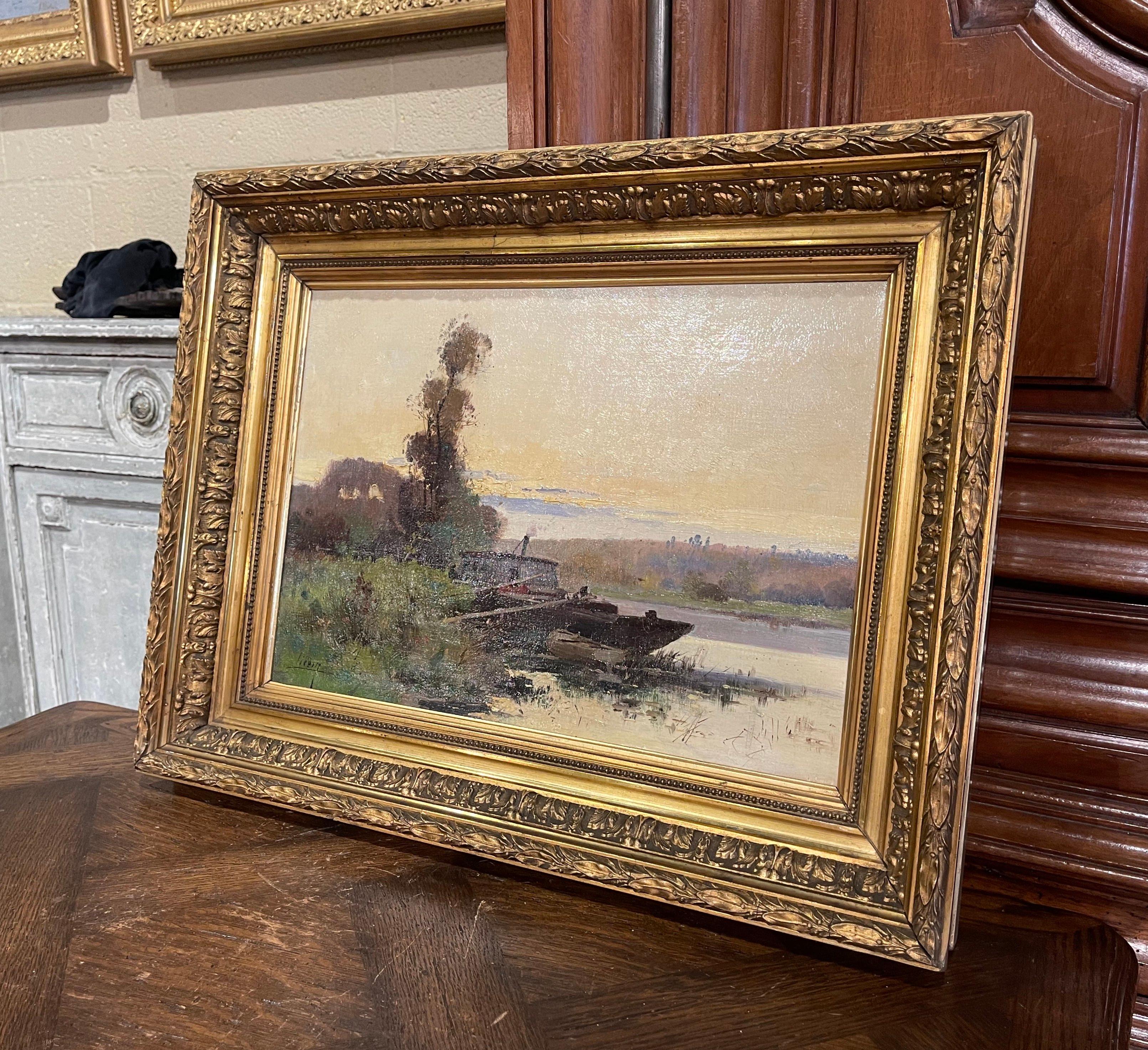 Decorate a study, living room or den with this beautiful and colorful antique oil painting! Painted in France circa 1890, the artwork is set in the original carved gilt wood frame; it illustrates a picturesque, country scene in rural France with a