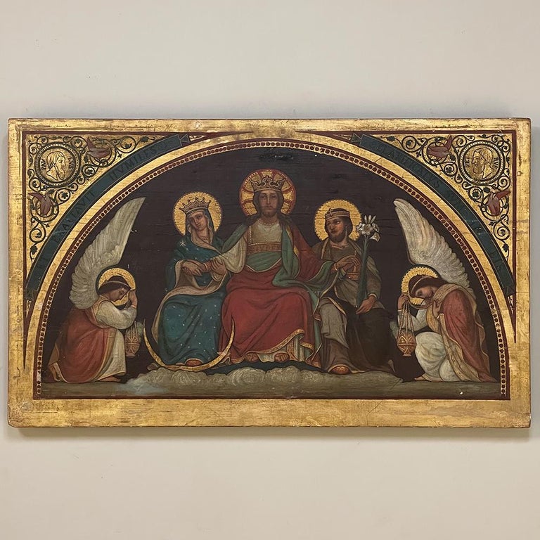 19th century oil painting on board of Holy Family is a stunning work in the Renaissance Revivalist style, rendered on solid planks of pine to depict Jesus, Mary & Joseph flanked by two praying angels. The demilune composition allows ornamentation in