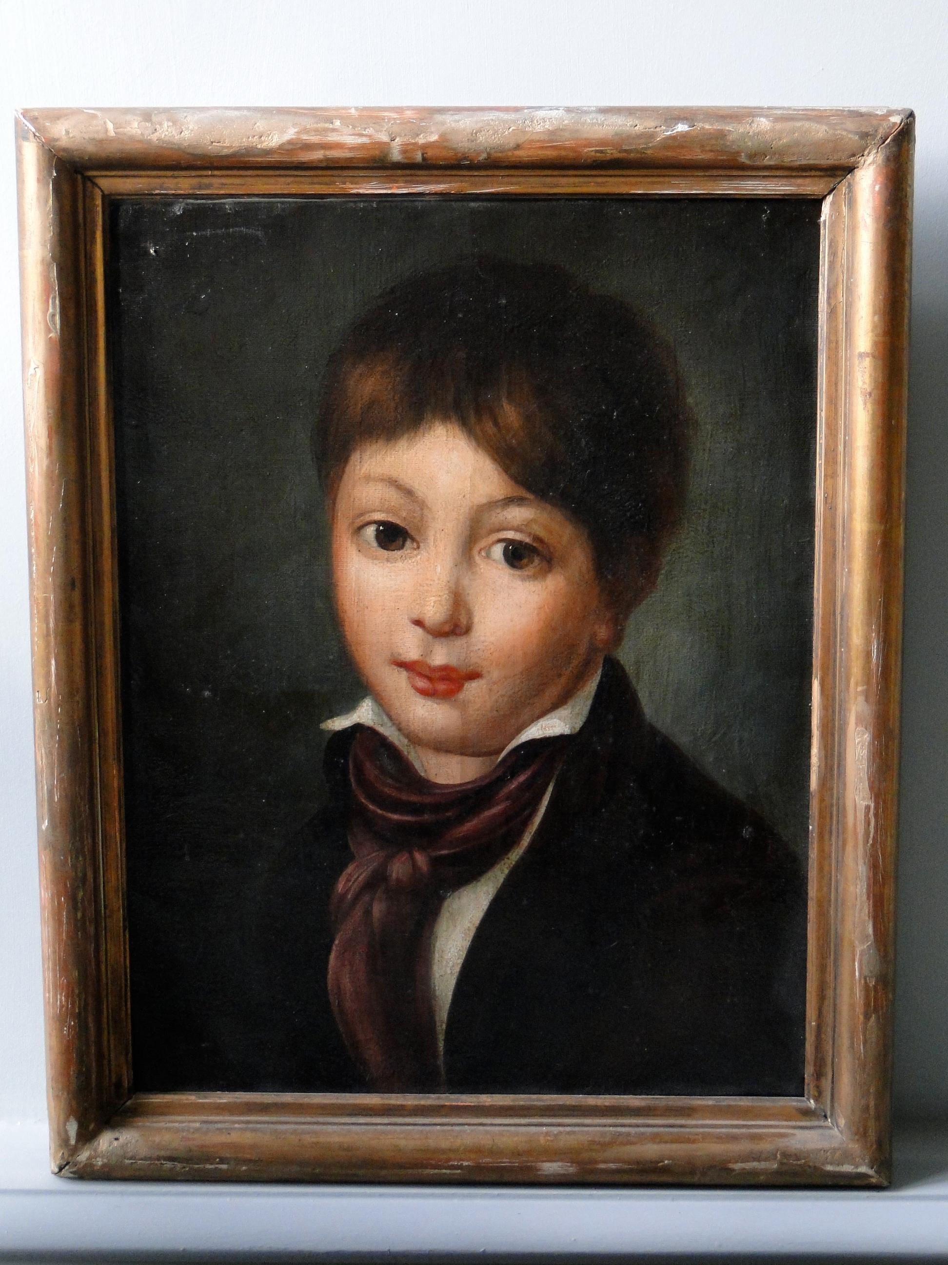 19th century painting on canvas of a boy. Gilded frame.