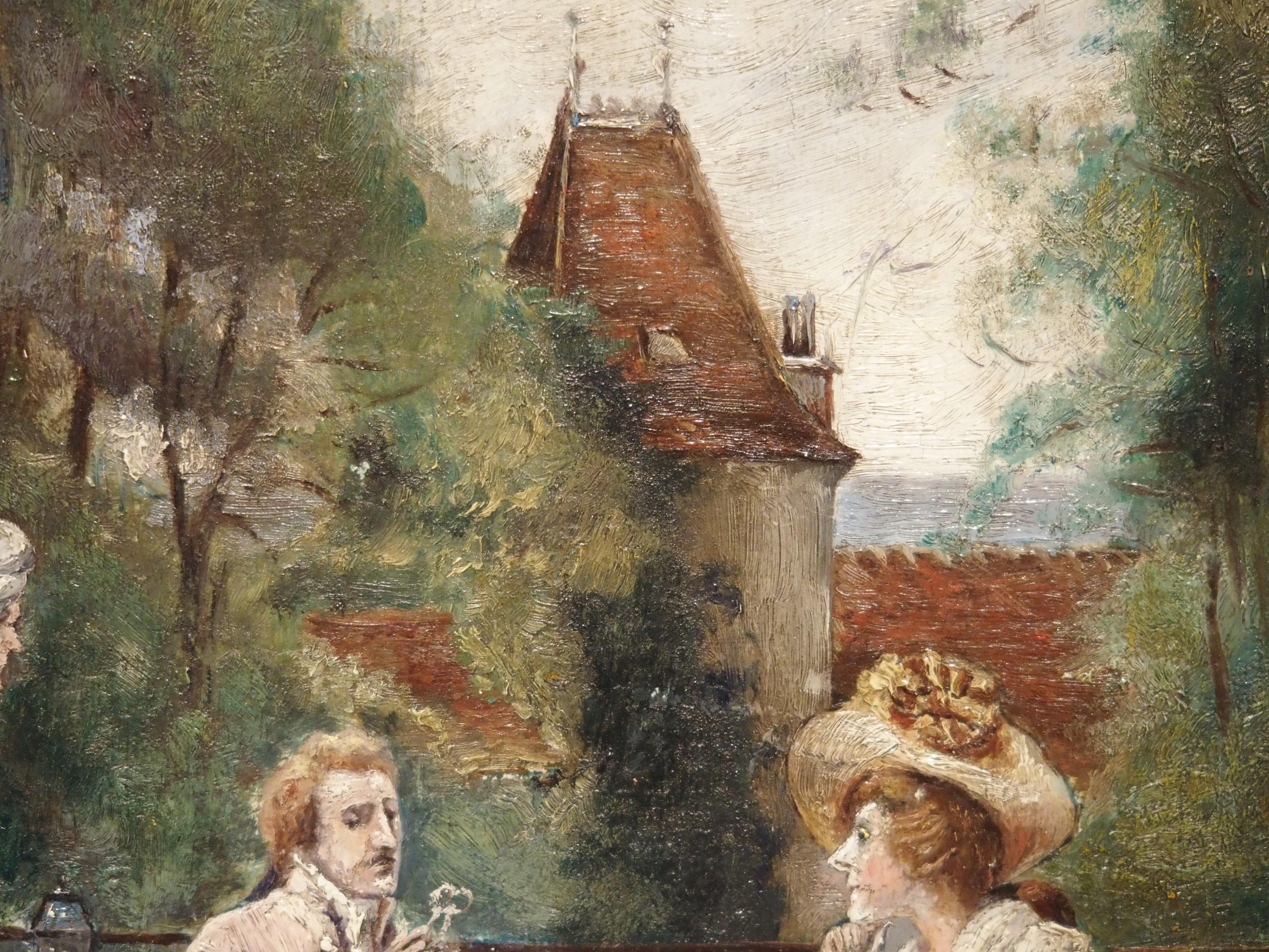 This charming gilt framed oil painting on board depicts a couple dining on a restaurant’s outside terrace, with the waiter standing beside them. The scene takes place at the end of the meal, as the gentleman has his spectacles out and is reading the