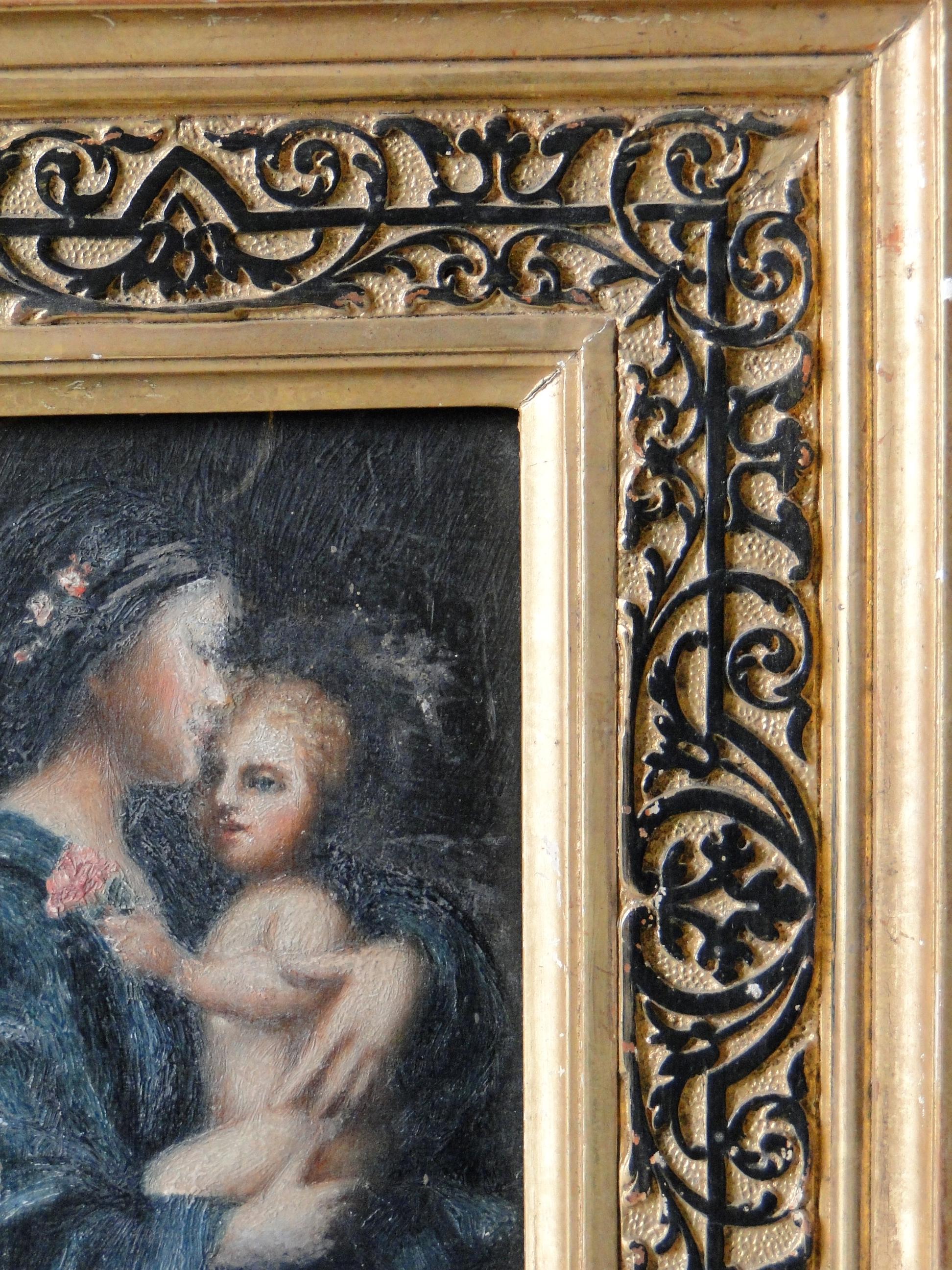 19th century oil painting of Maria with child on wood panel with gilded frame.