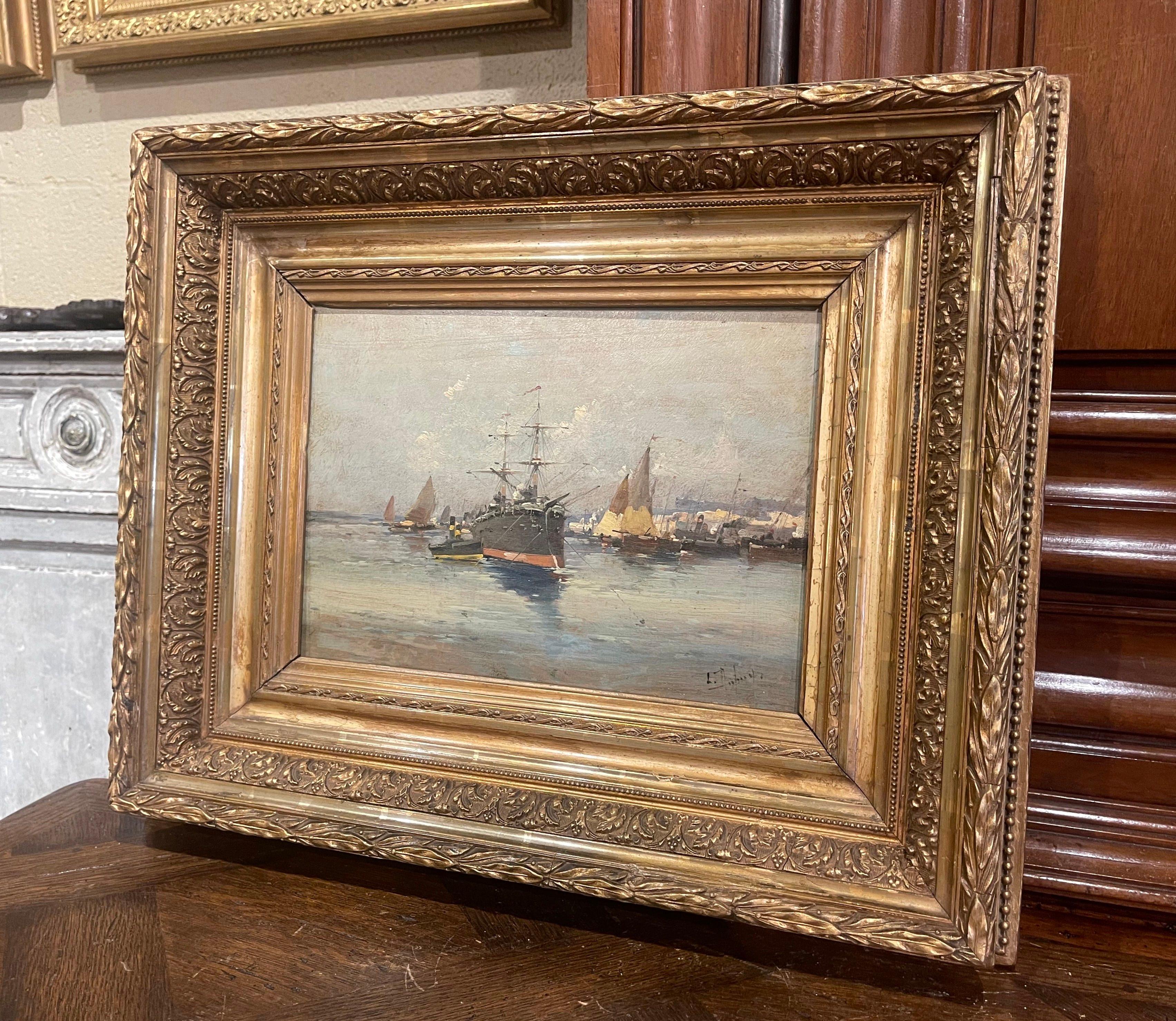 Decorate a study, living room or den with this beautiful and colorful antique oil painting! Painted in France circa 1890, the artwork is set in the original carved gilt wood frame; it illustrates a picturesque, ocean-front port scene in coastal