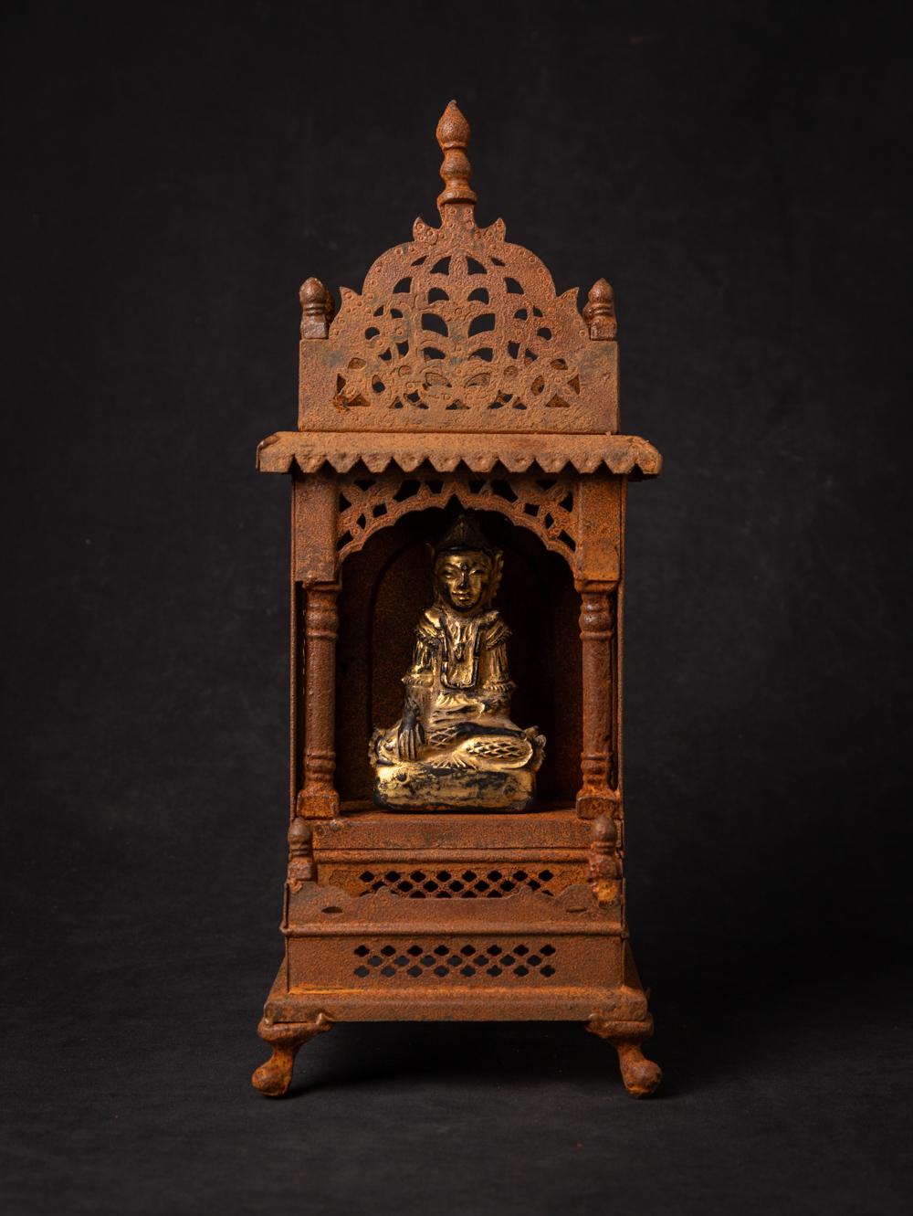 Old metal temple with antique wooden Buddha statue

Material: Metal
37 cm high
15 cm wide and 14,1 cm deep
The temple is originating from Nepal
The gilded Buddha is from Burma and is dating from the 19th century
Weight: 1,21 kgs
Originating from