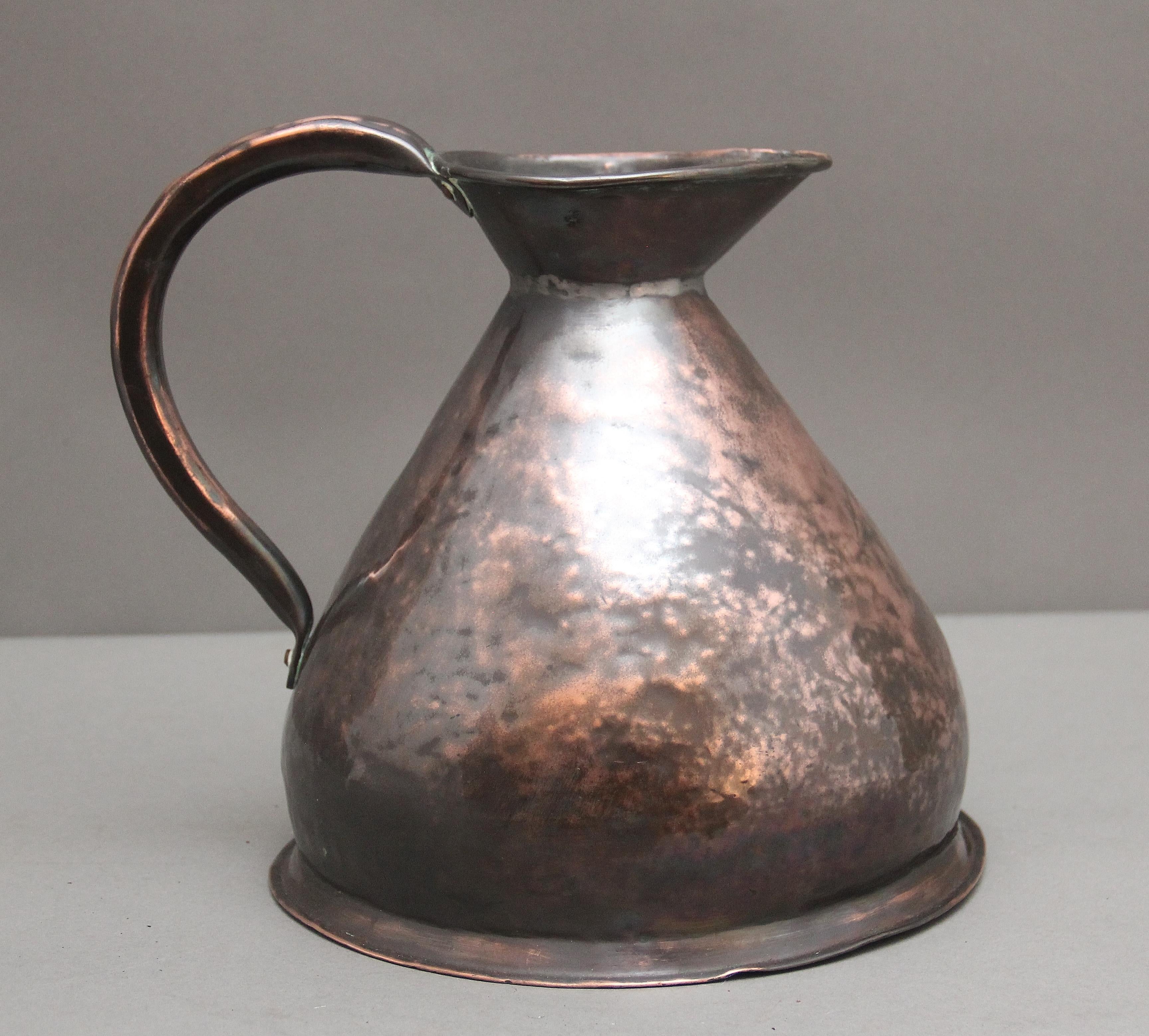 19th Century one gallon copper haystack measuring jug in very good condition, having a large shaped handle to one side, the haystack jug named for it's wide based form and having a large spout.  Circa 1870.