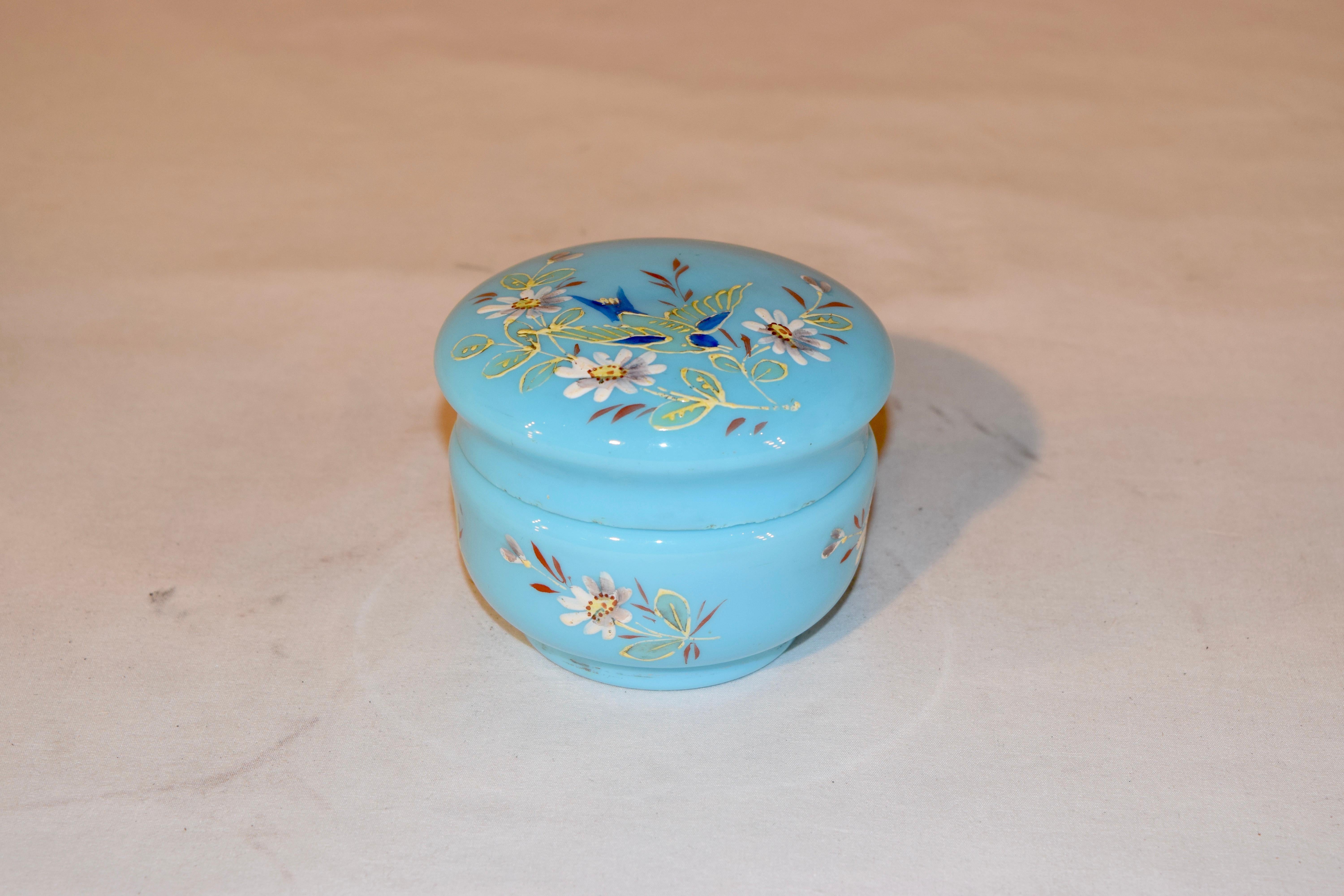 19th century blue opaline glass jar from France with hand painted floral decorations on lid and base.
