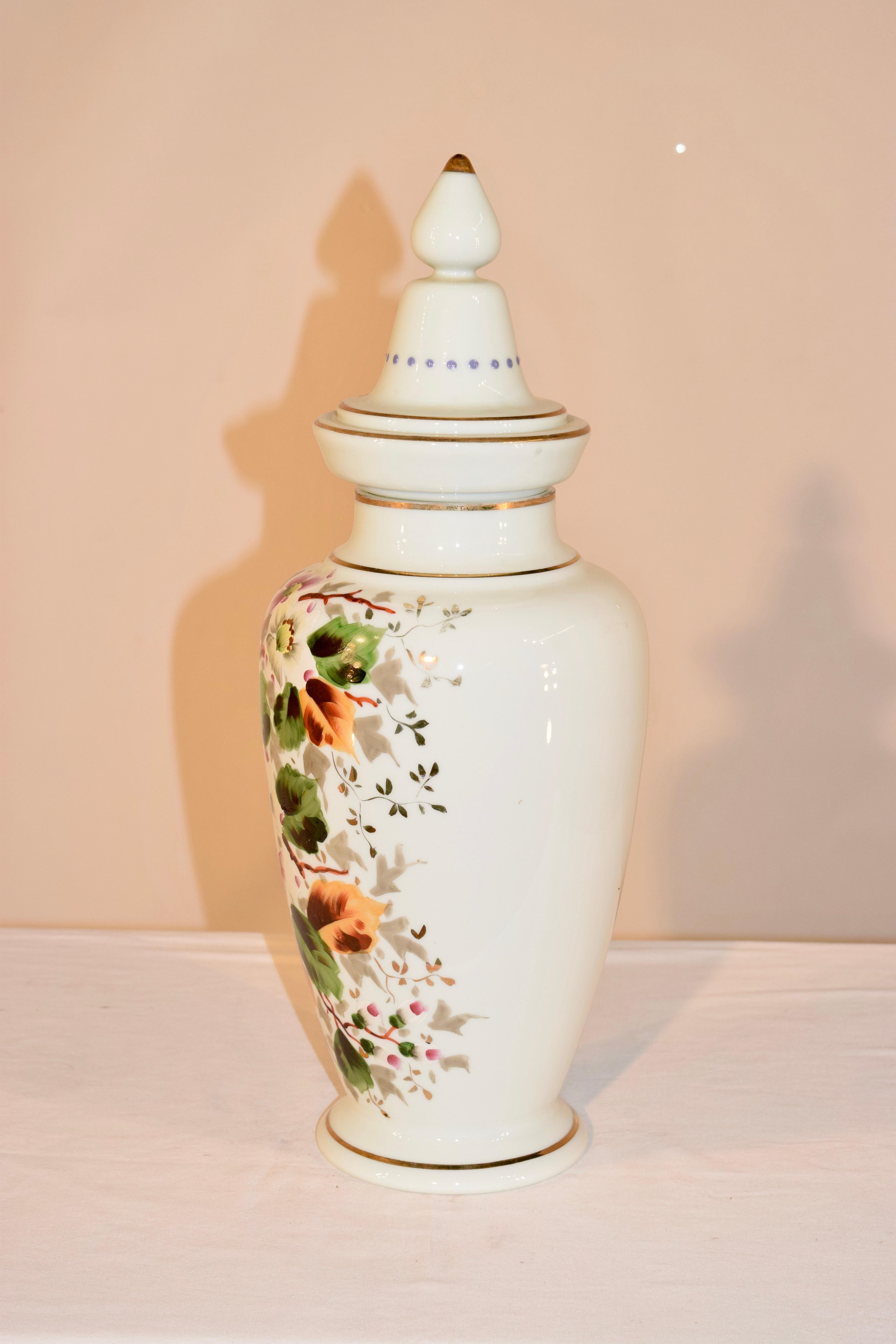 Late 19th century opaline glass lidded urn from France with wonderfully hand painted florals and vines.
