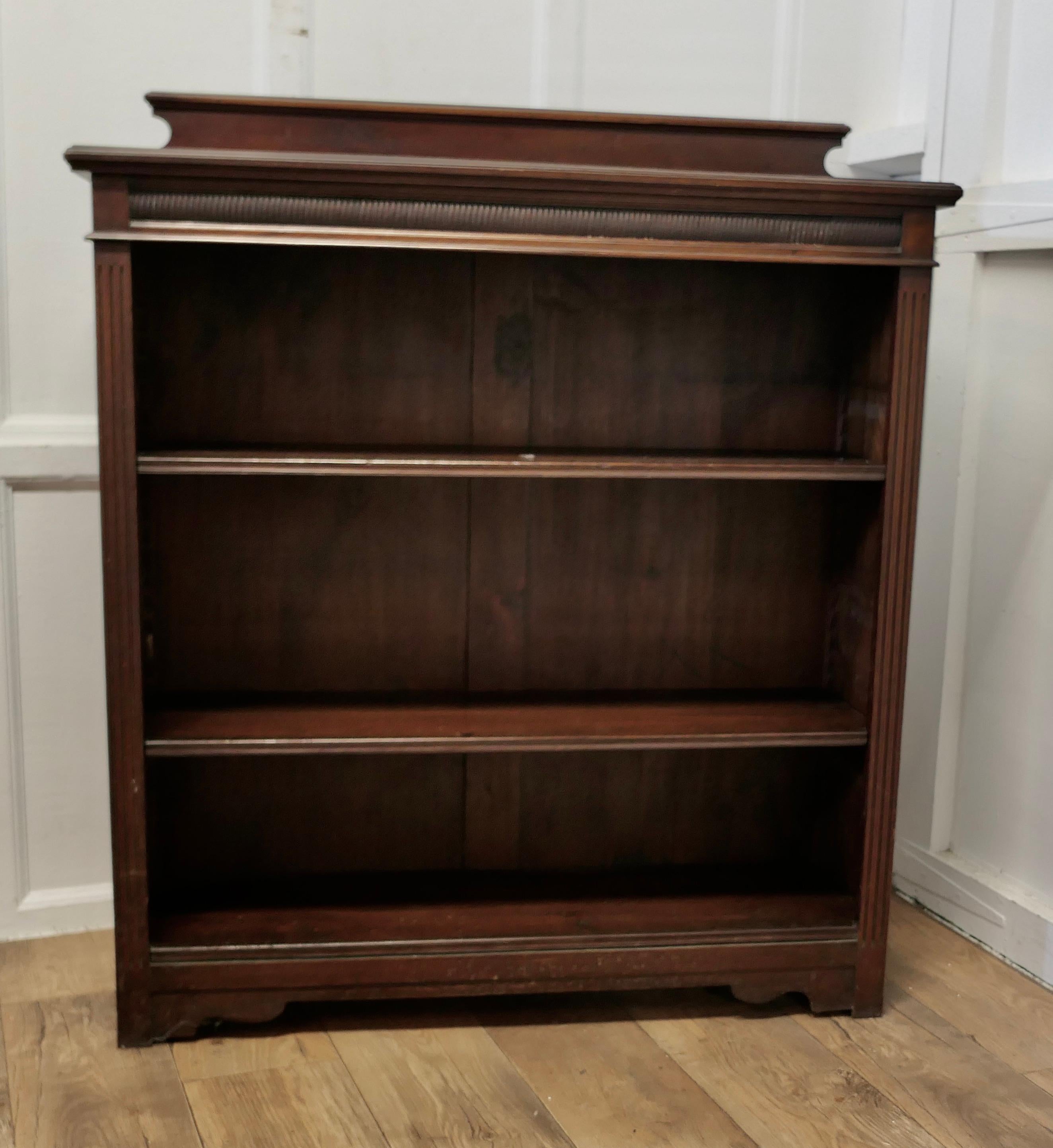 19th Century Open Bookcase.

This is a good roomy bookcase with a 4” gallery at the back and adjustable shelves, the top has a very attractive moulded edge and it stands on neat bracket feet  
The bookcase is in good attractive condition and the