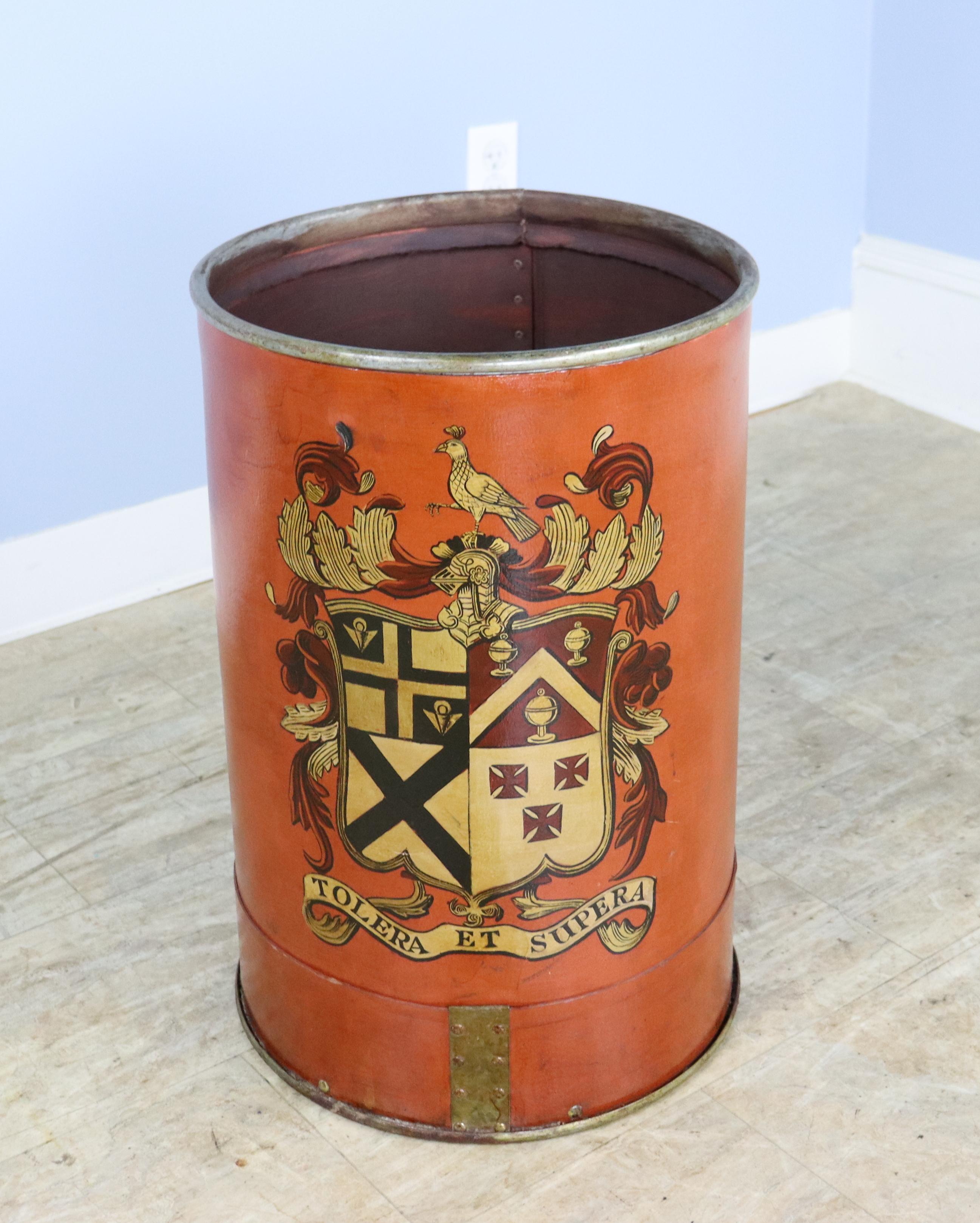 An antique mill bucket, made of compressed metal and newly decoratively painted.  Manufactured in Lancashire, England, originally for use in holding bolts of cloth.  Would make a good umbrella stand or log bin.