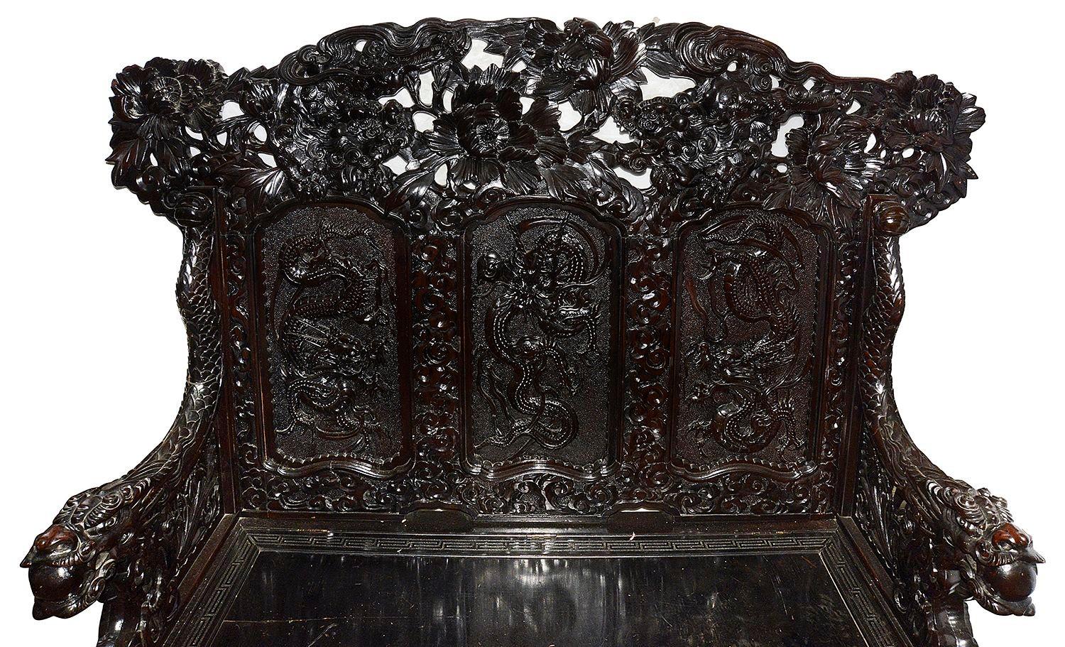 This spectacular 19th Century hand carved oriental hall bench, with wonderful classical chrysanthemums, scrolling foliage, and mythical dragons.


Batch 75 62029.