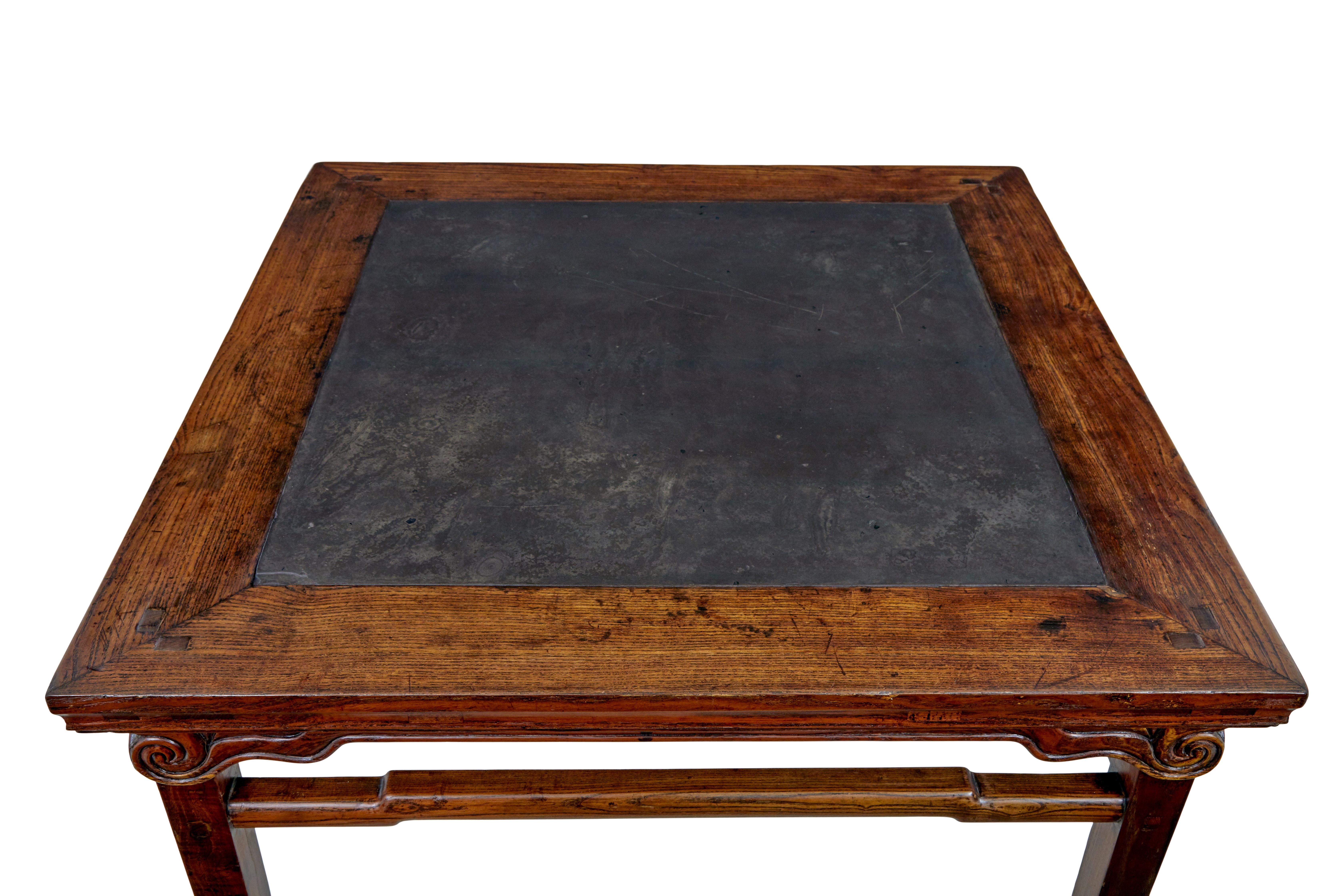 Large 19th century Chinese hard wood marble inset table circa 1880.

Good quality hard wood Chinese table with a dark grey marble panel inset into the top.  Marble has a great patina and natural finish to the surface.  Square top with carved scrolls