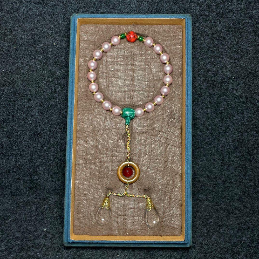 19th Century Oriental Imperial Eighteen Pink Pearls Bracelet – A Symbol of Nobility, Harmony, and Prosperity

This 19th Century Oriental Imperial Eighteen Pink Pearls Bracelet is a rare and exquisite piece, reflecting the elegance and prestige of
