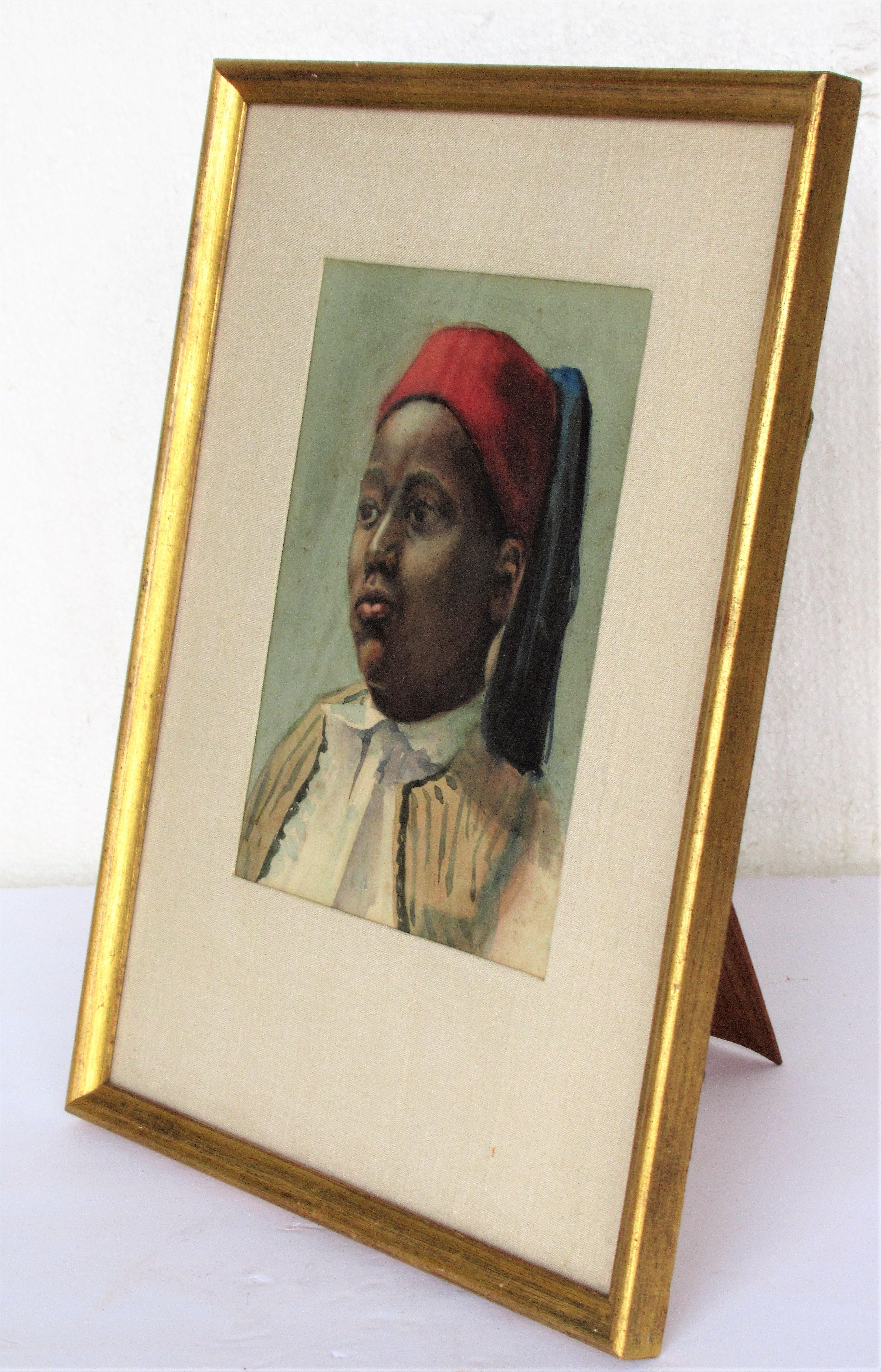 19th century orientalist watercolor painting on artist board, portrait of young boy wearing a fez. Set in a nice vintage giltwood and glass tabletop frame with linen mat. Nice little painting. Look at all pictures and read condition report in