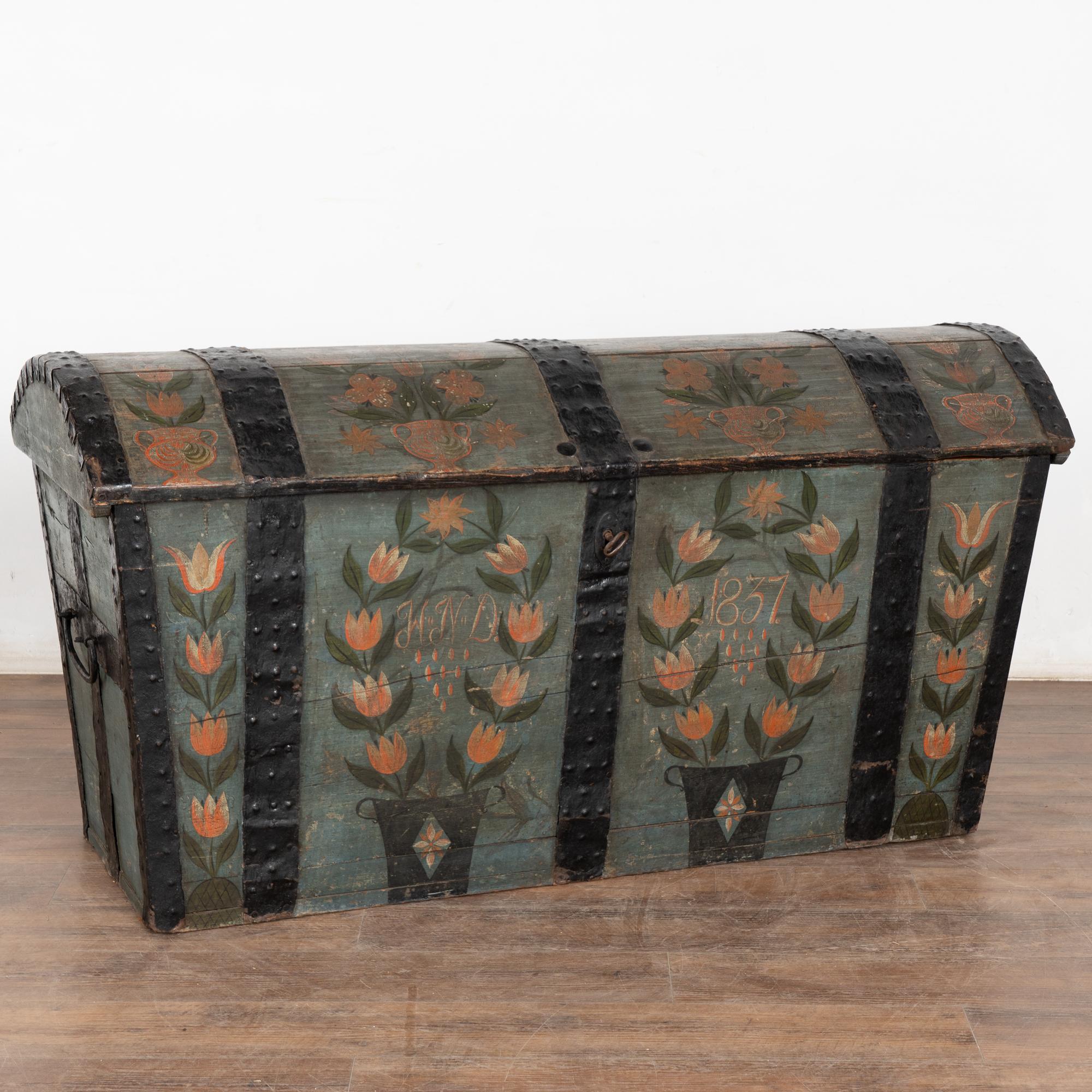 Original blue painted dome top oak trunk from Sweden with wrought iron straps and side handles.
Monogram and date 
