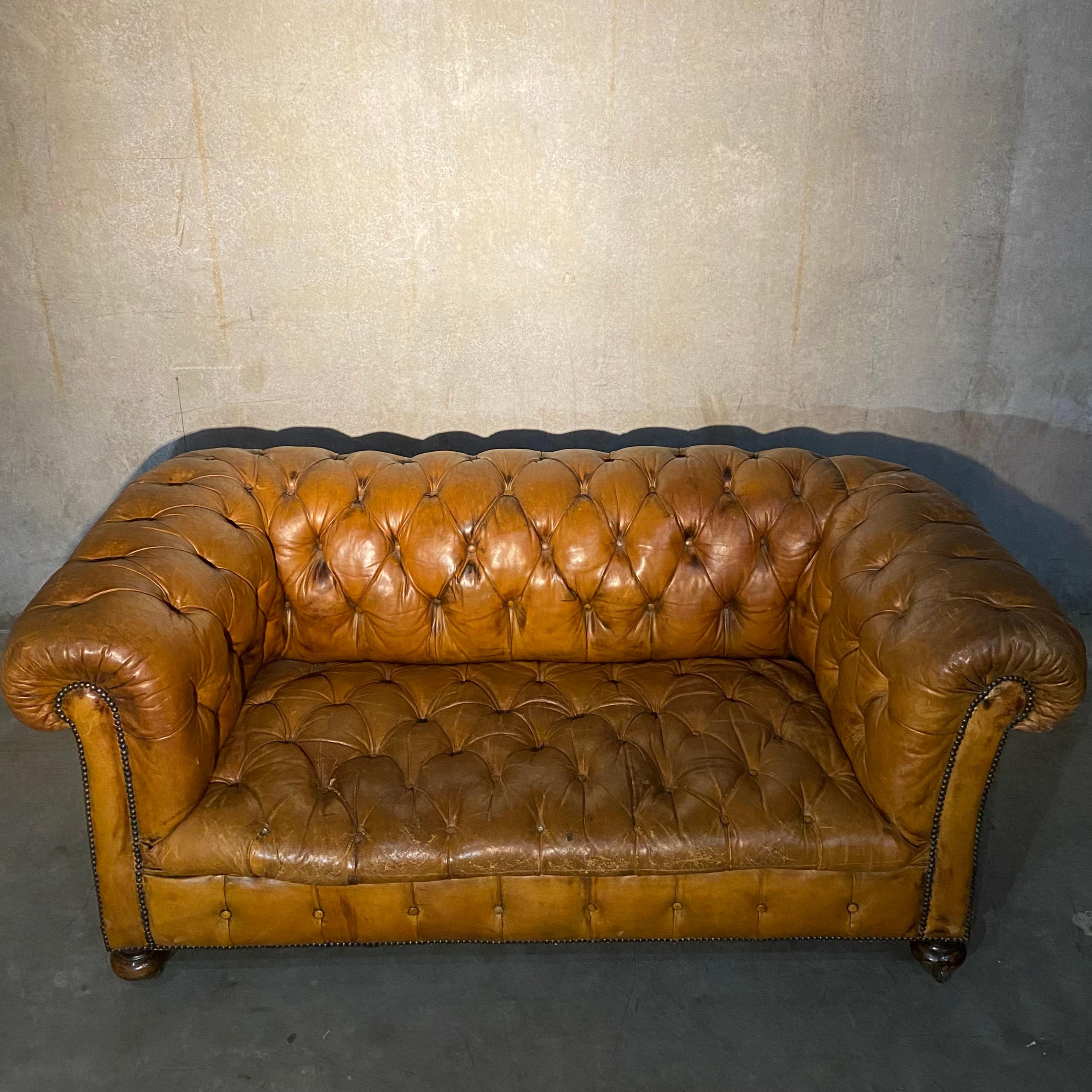 A very good true leather tufted sofa in old worn, perfect patina. Solid seating. Good overall condition and very rare find. Acquired from a private collection of old antique dealer who imported to Canada in the 50's.

Not perfect but very very