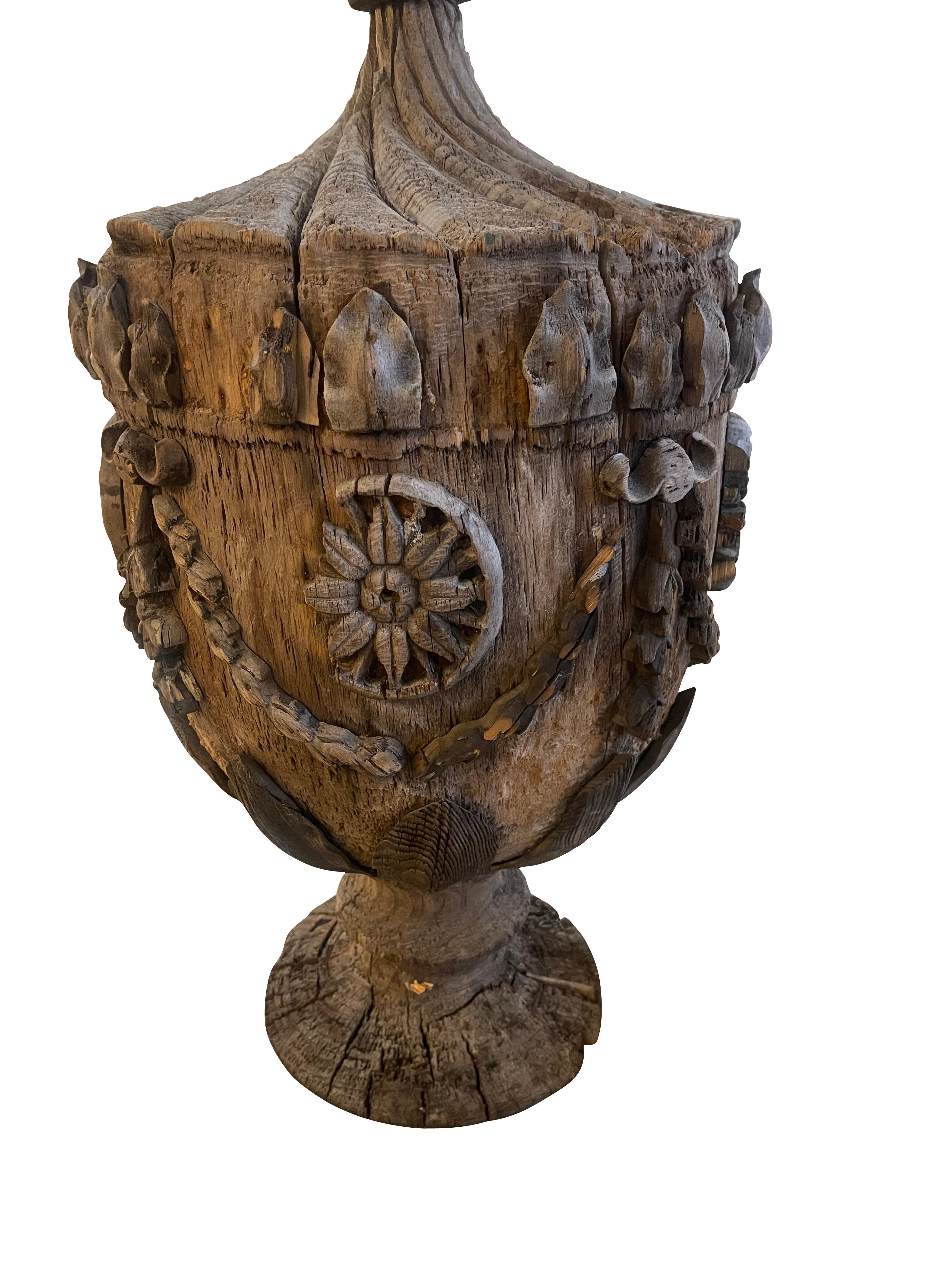 Hand carved and crfated 30 inch high wooden garden finial decorated with neoclassical garlands, foliate designs and decorative carvings.  this is truly a spectacular piece for a garden room, greenhouse or outdoor patio.  The surface of the fial has