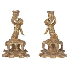 19th century ormolu pair of bronze cherubs or putti candlestick holders.