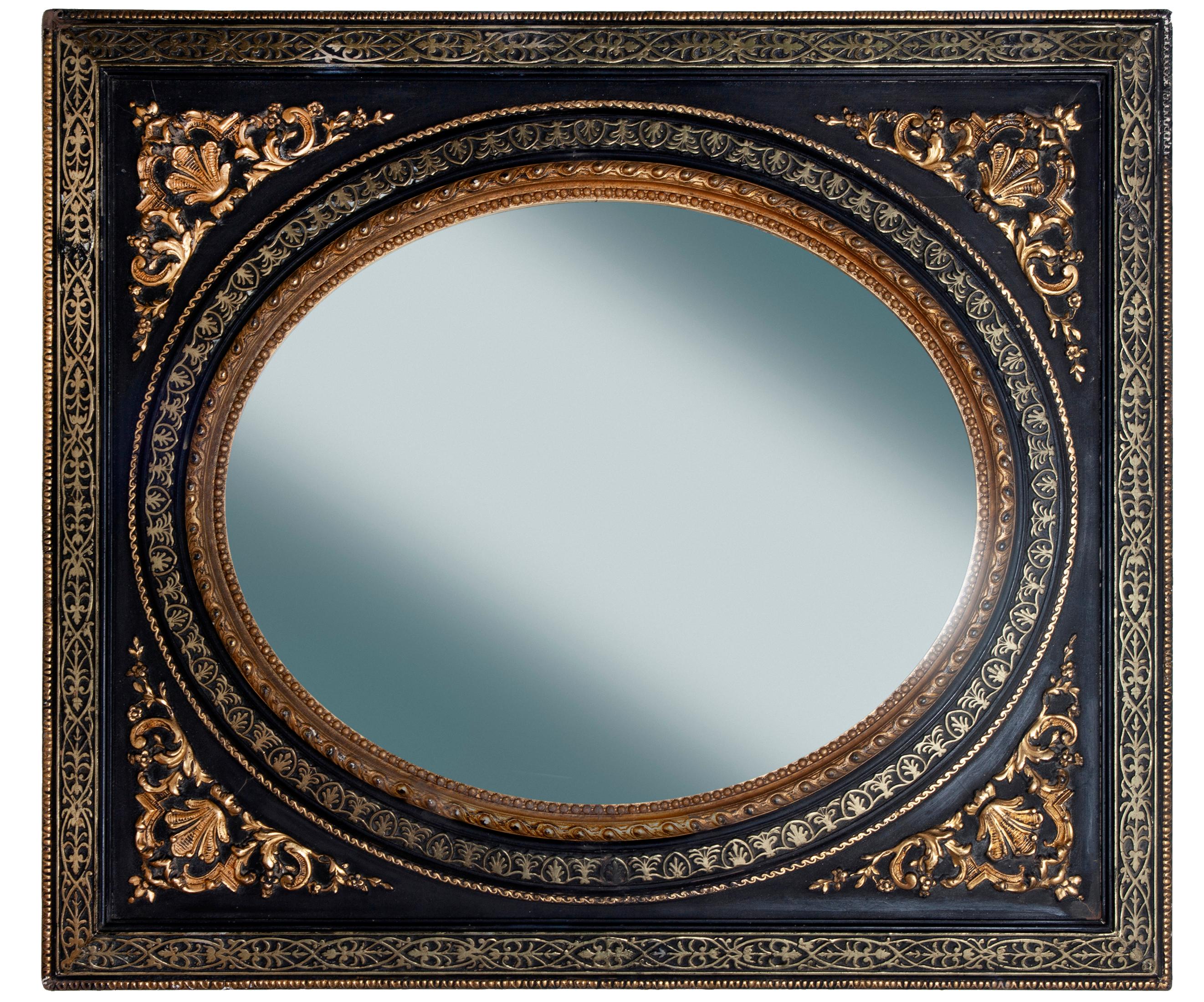 19th Century black & gold antique European gilt & ebony Empire mirror featuring raised gold gilt in pale & bright gold. Oval insert. Ebony background. Restored with new wood backing, extremely heavy.