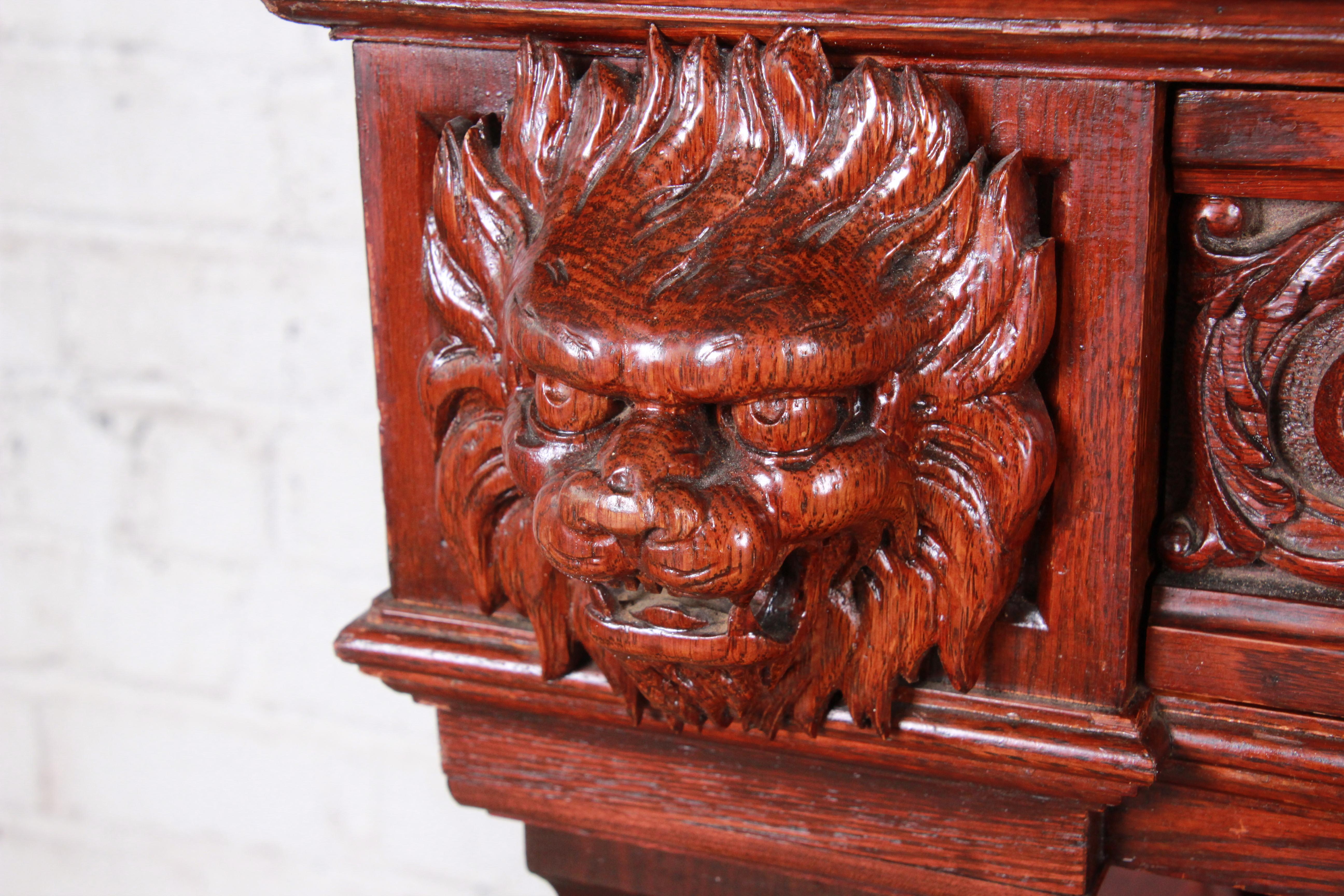 Black Forest 19th Century Ornate French Oak Sideboard Hutch or Bar Cabinet with Carved Faces