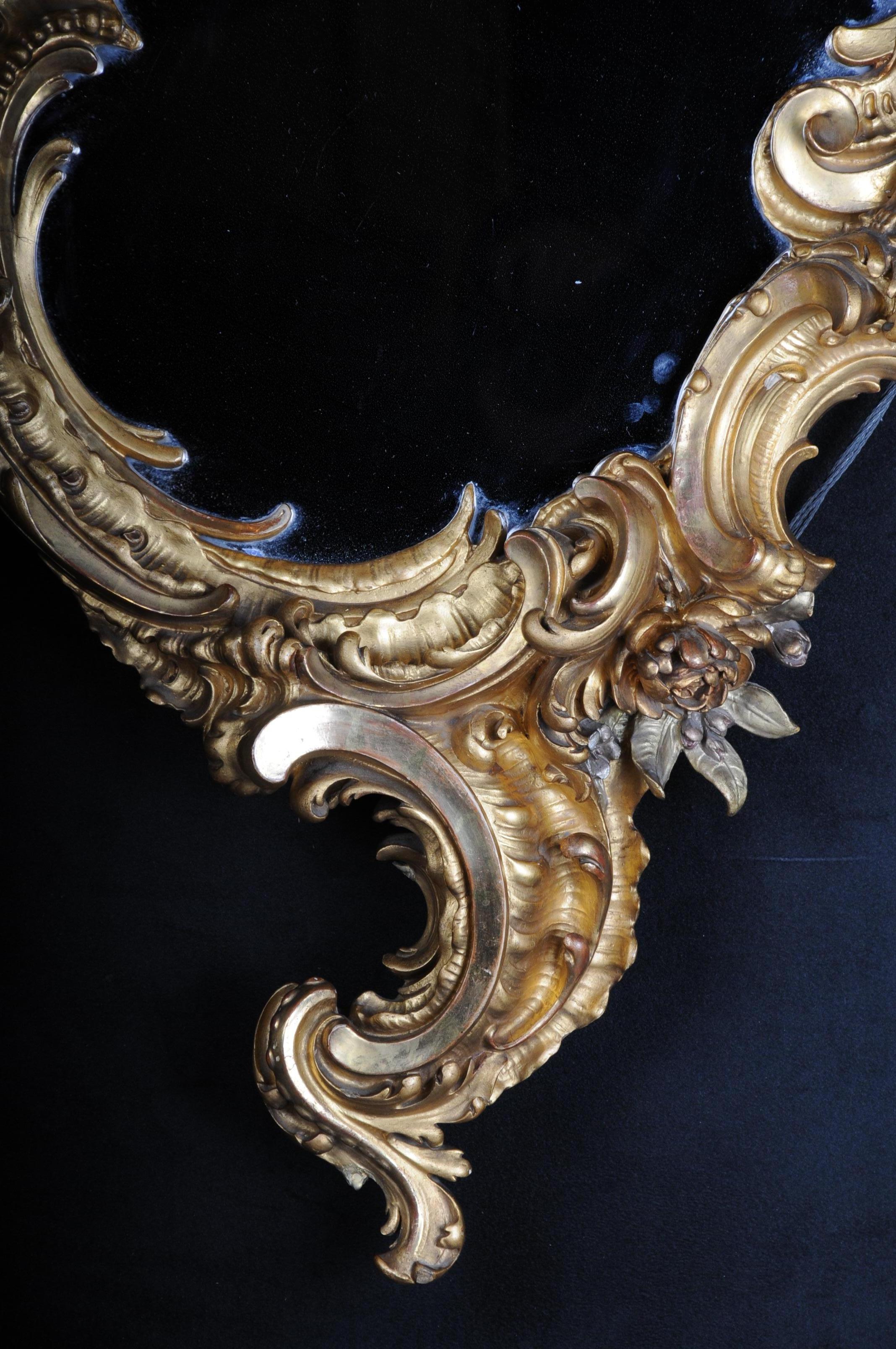 Ornate rococo mirror, solid wood gilded in 1870, Paris
Ornate and gold leaf mirror, Paris, circa 1870
Rocaille body framed with rich rococo carving. Rocaille-shaped mirror frame with flowers and Puttos.
Old mirror glass. Extremely high quality