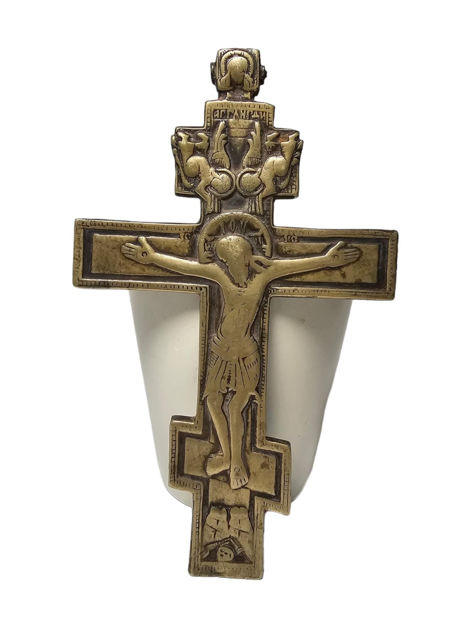 This magnificent 19th-century Orthodox cross is crafted in bronze, a material that ensures its durability and beauty over time. The dimensions of the cross are 17 cm in height, 10 cm in width, and 1 cm in thickness, making it a compact yet