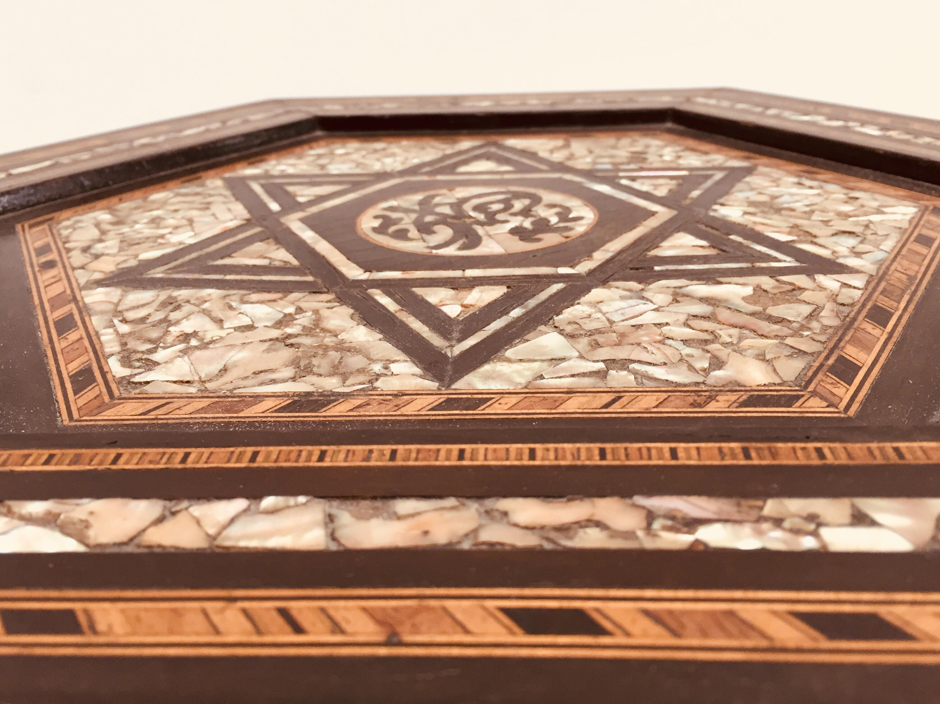 19th century ottoman Moorish table.
Antique fine example side table with a hexagon form inlaid with geometric designs with the Moorish star shape and Arabic calligraphy ottoman writing. 
Dimension: 19.5