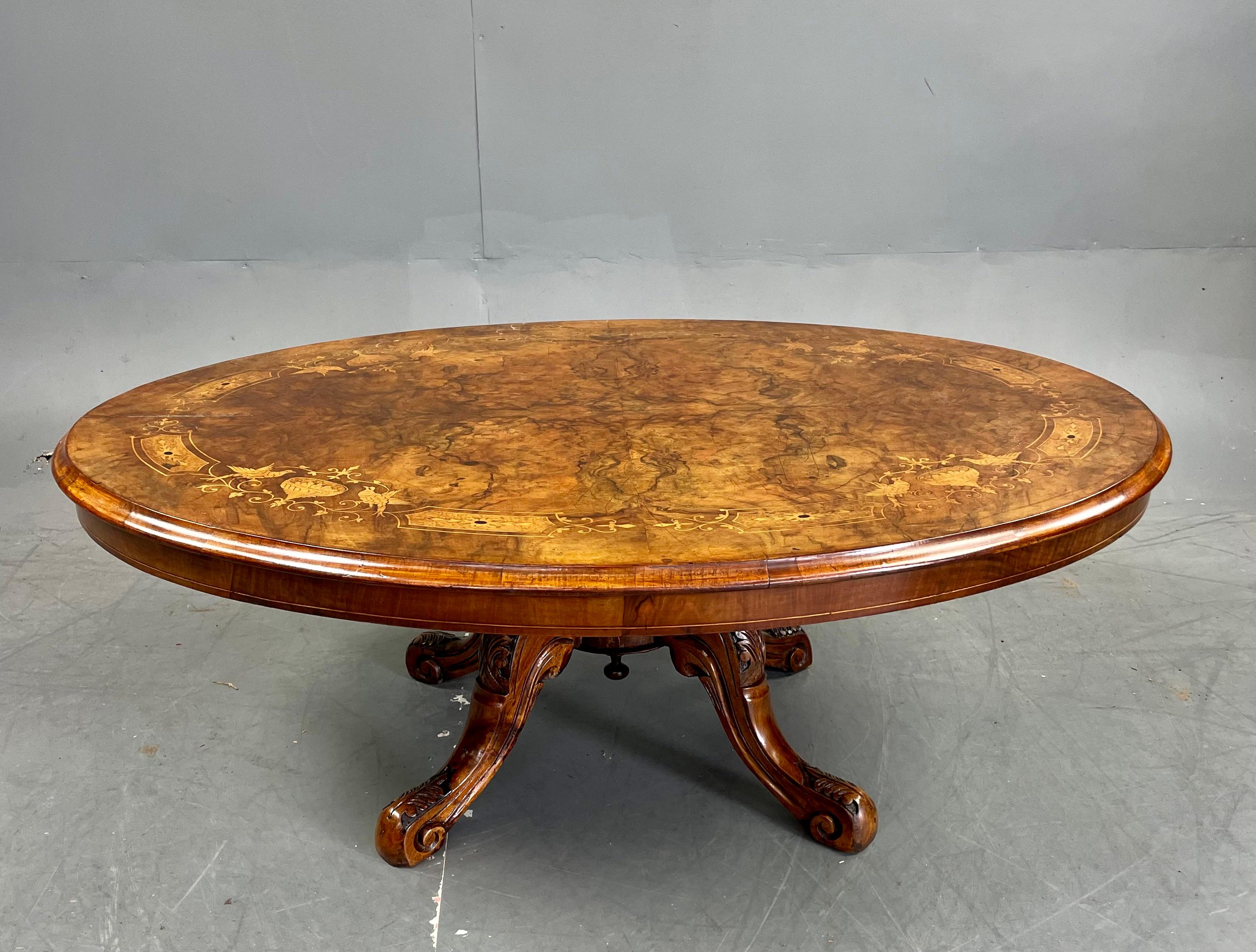 Fine quality Victorian burr walnut and box wood  inlaid coffee table circa 1870.
The base having four ring turn columns standing on carved cabriole legs 
The oval shaped top is a good size with a very good walnut colour and patina .
In very good