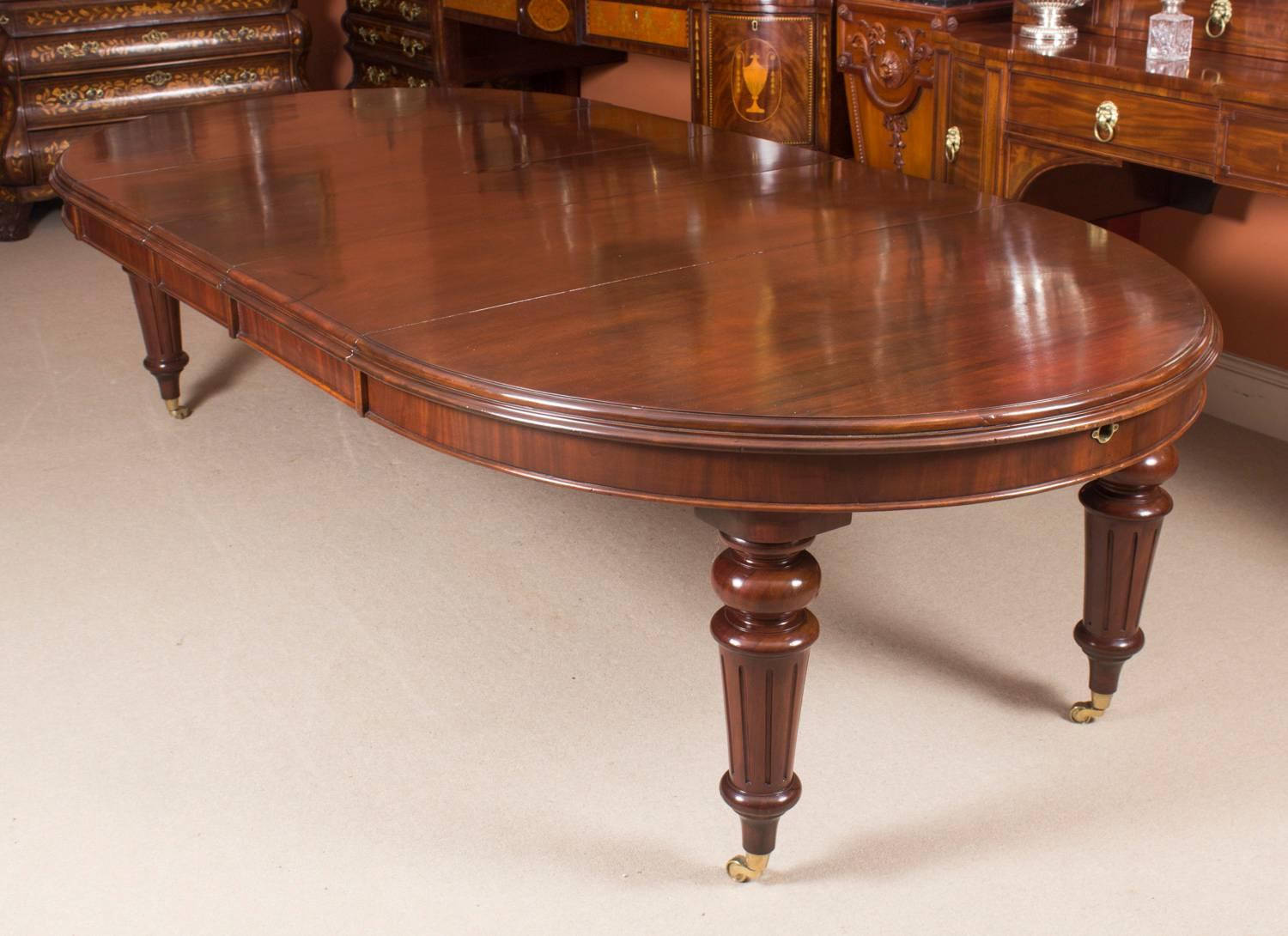 This is a fabulous antique Victorian oval solid mahogany extending dining table, circa 1870 in date, with a bespoke set of ten balloon back dining chairs.

The table has three original leaves and can comfortably seat ten. It has been handcrafted