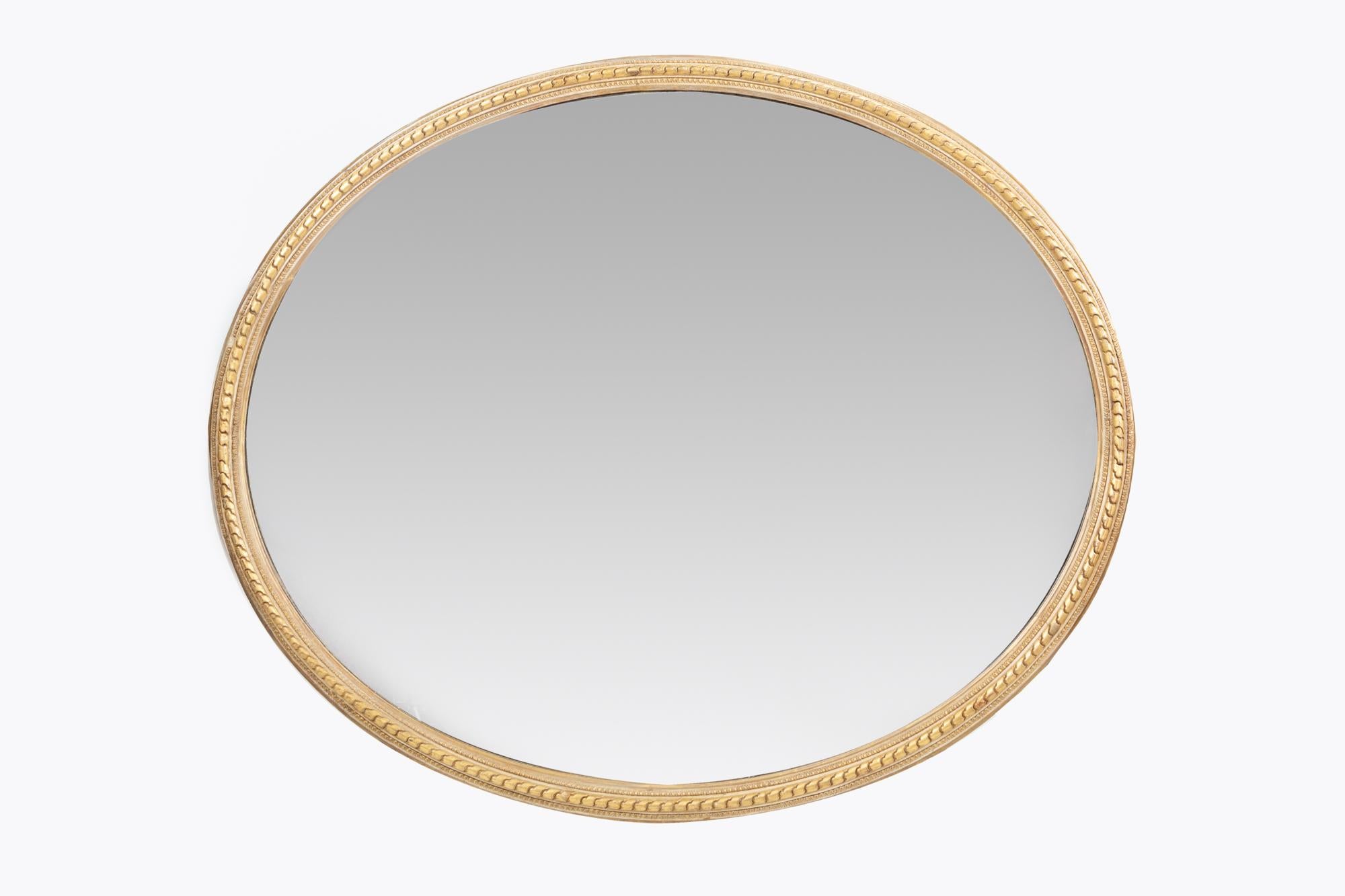 19th century oval gilt mirror.
