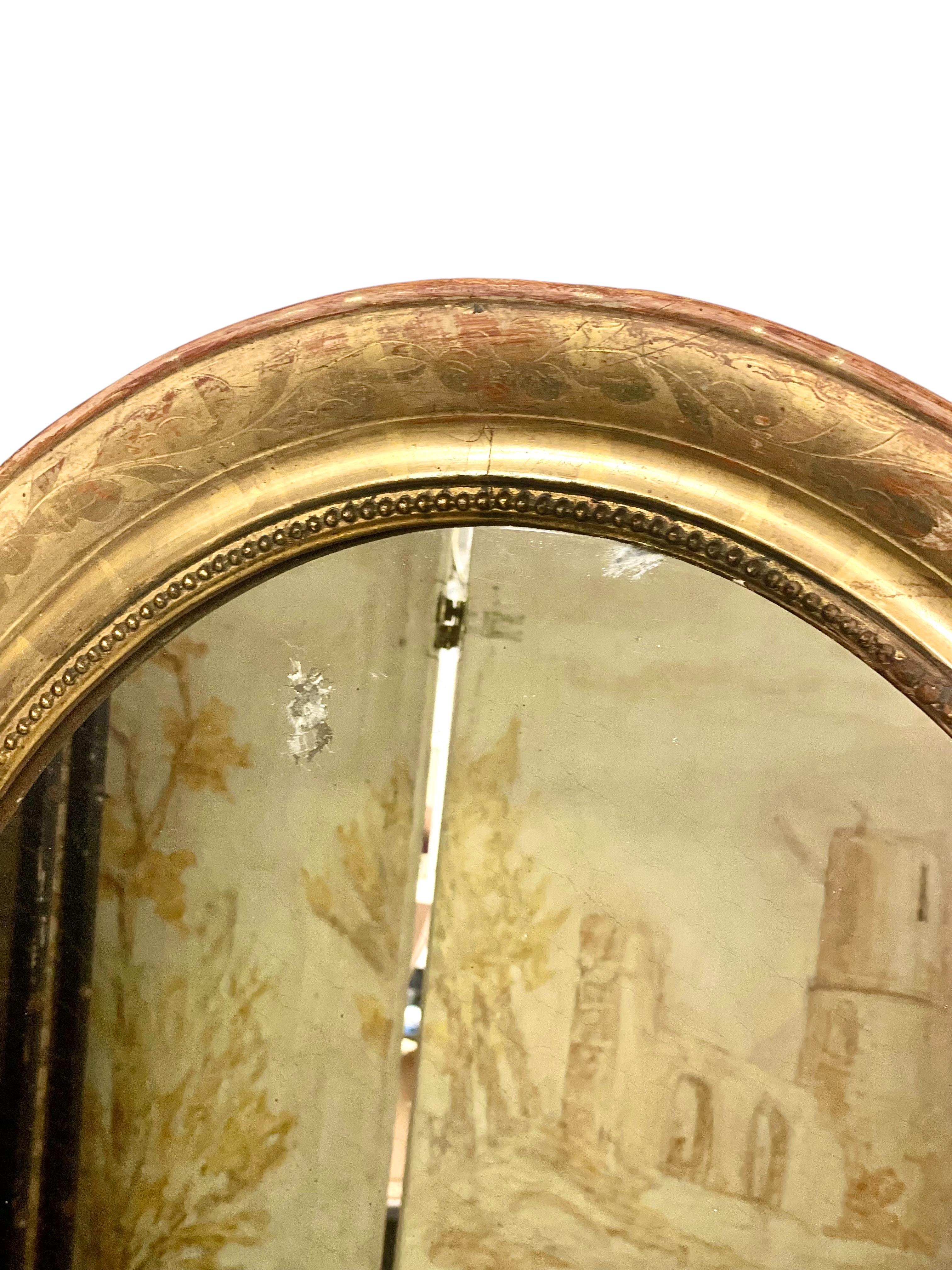 Doré Miroir mural ovale doré du 19e siècle en vente