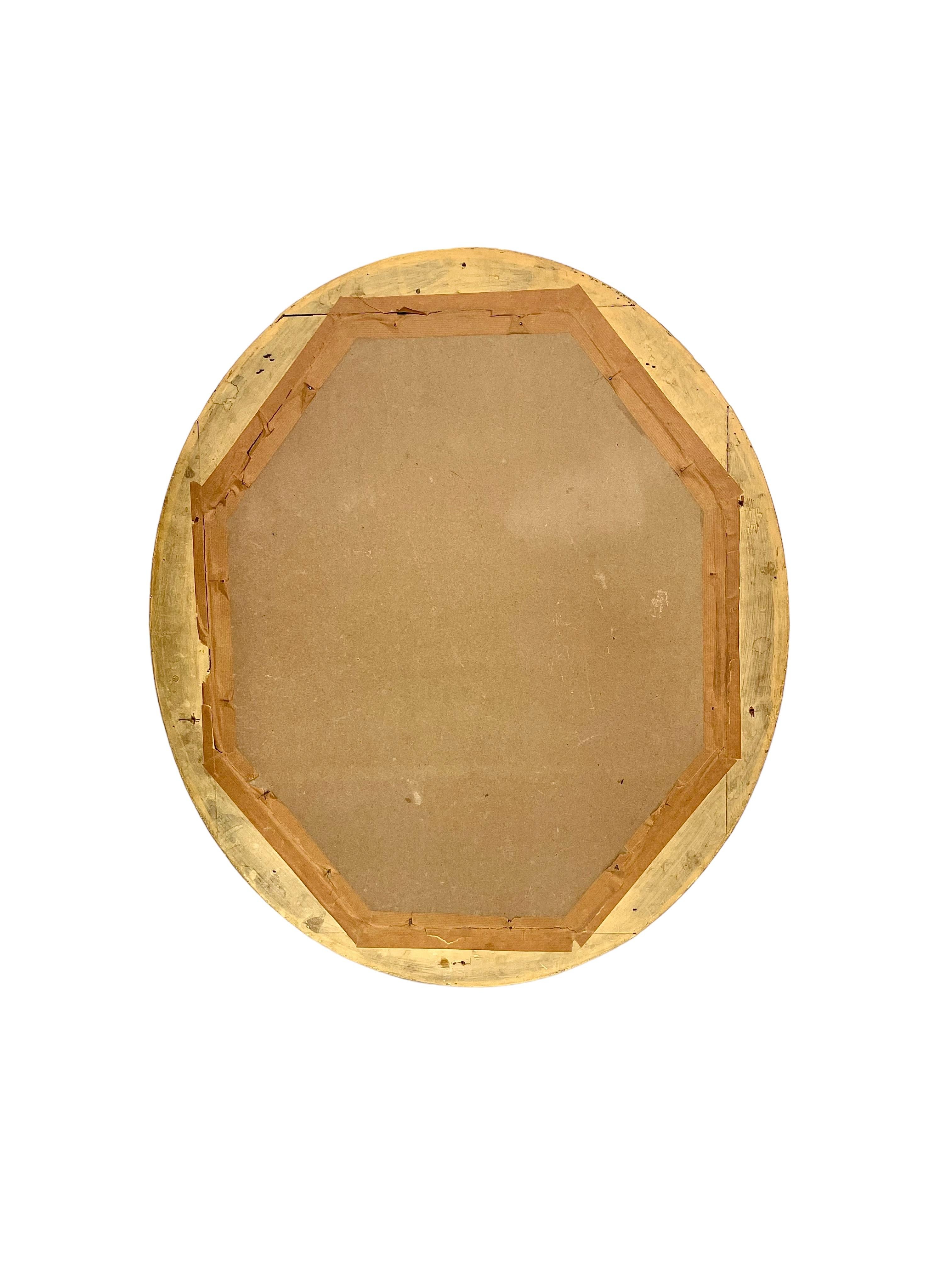 Bois doré Miroir mural ovale doré du 19e siècle en vente