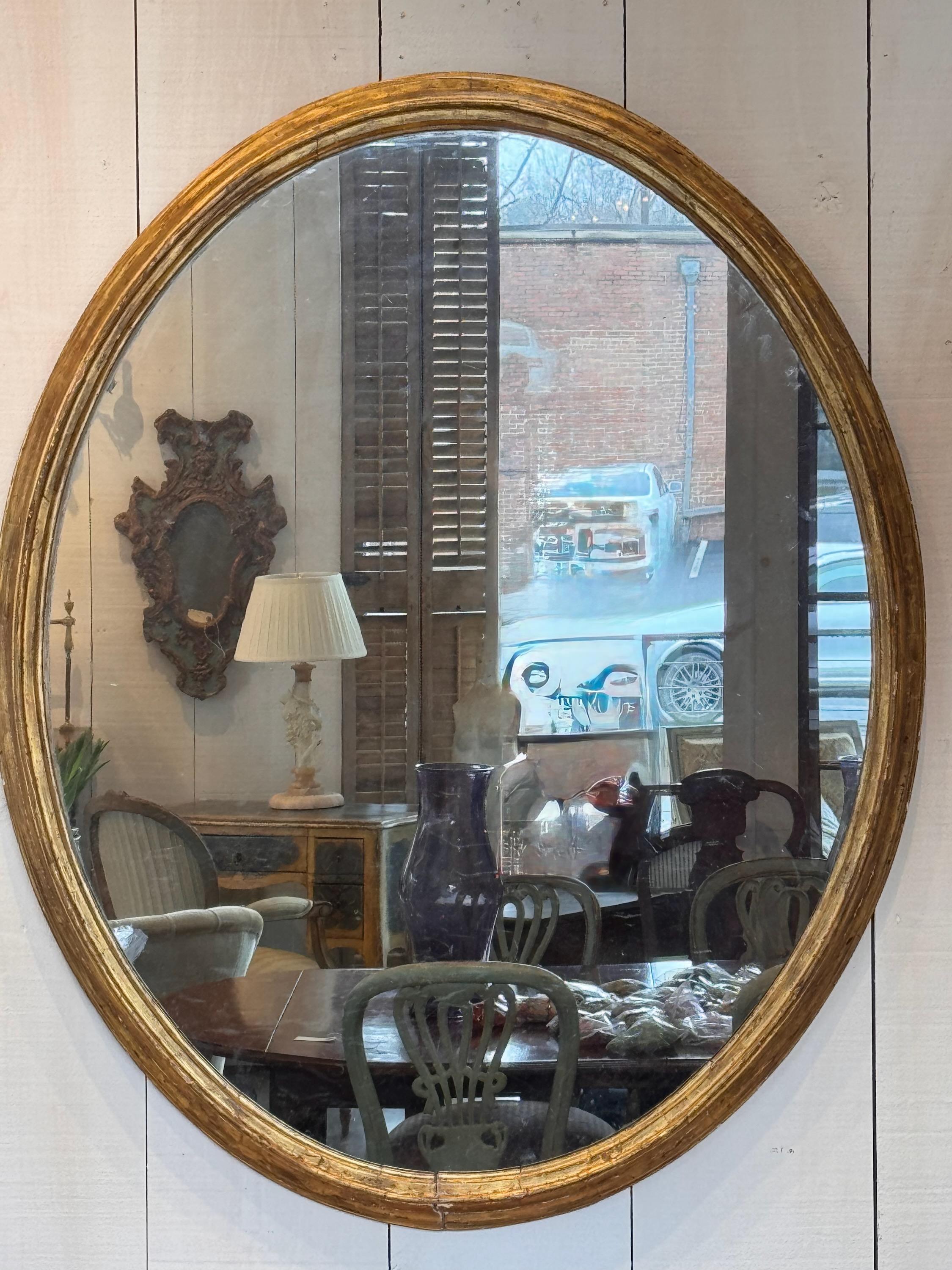 French 19th Century Oval Mirror With Giltwood Frame