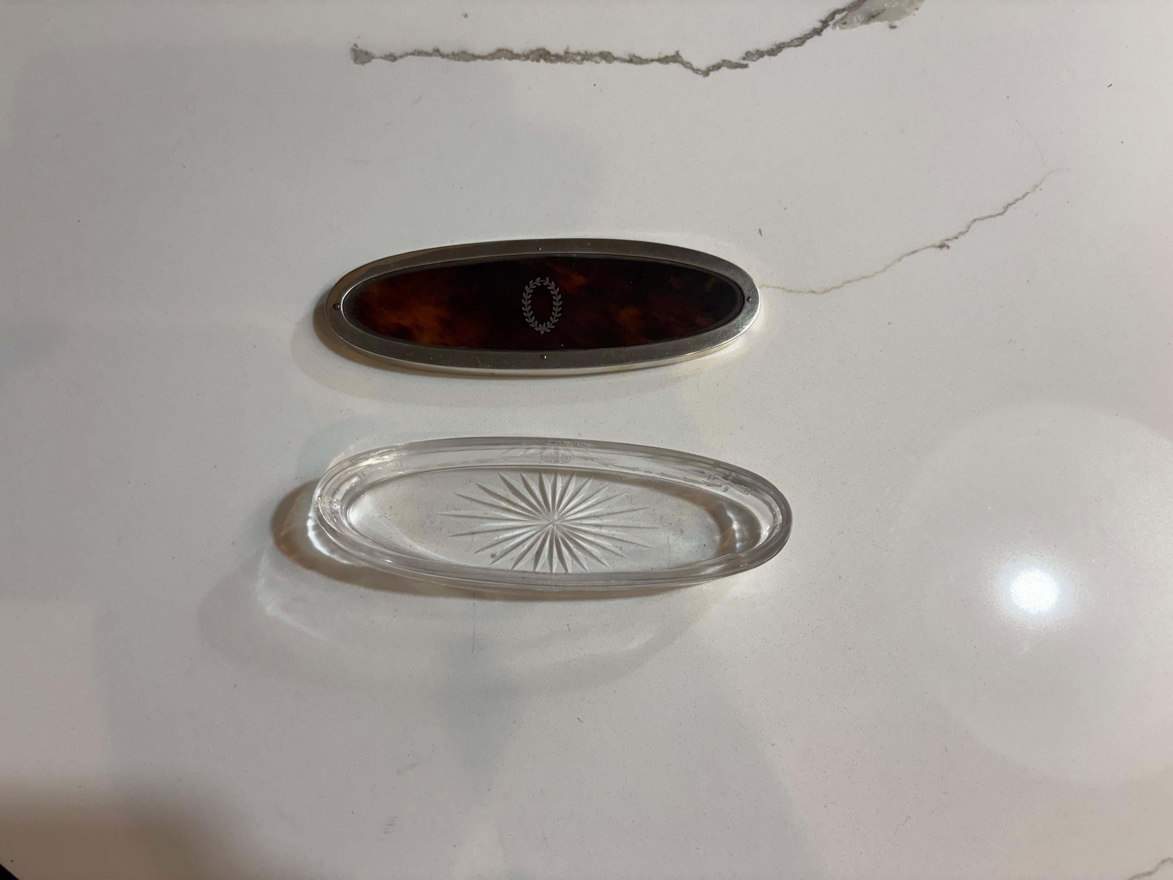 English 19th century oval tortoise shell box with glass base and maker markings. For Sale