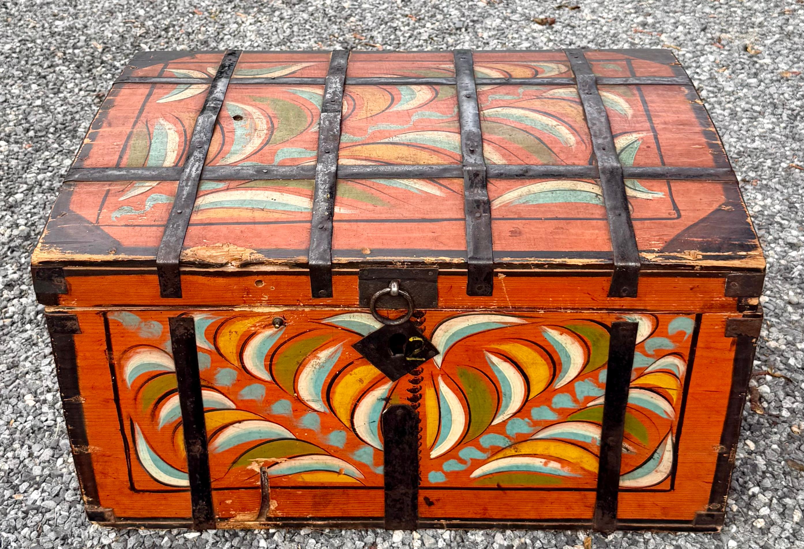 A 19th century American or possibly Scandinavian polychrome paint-decorated iron-bound storage box. Measures 13.5” x 25.5” x 18”.  Great early untouched condition.