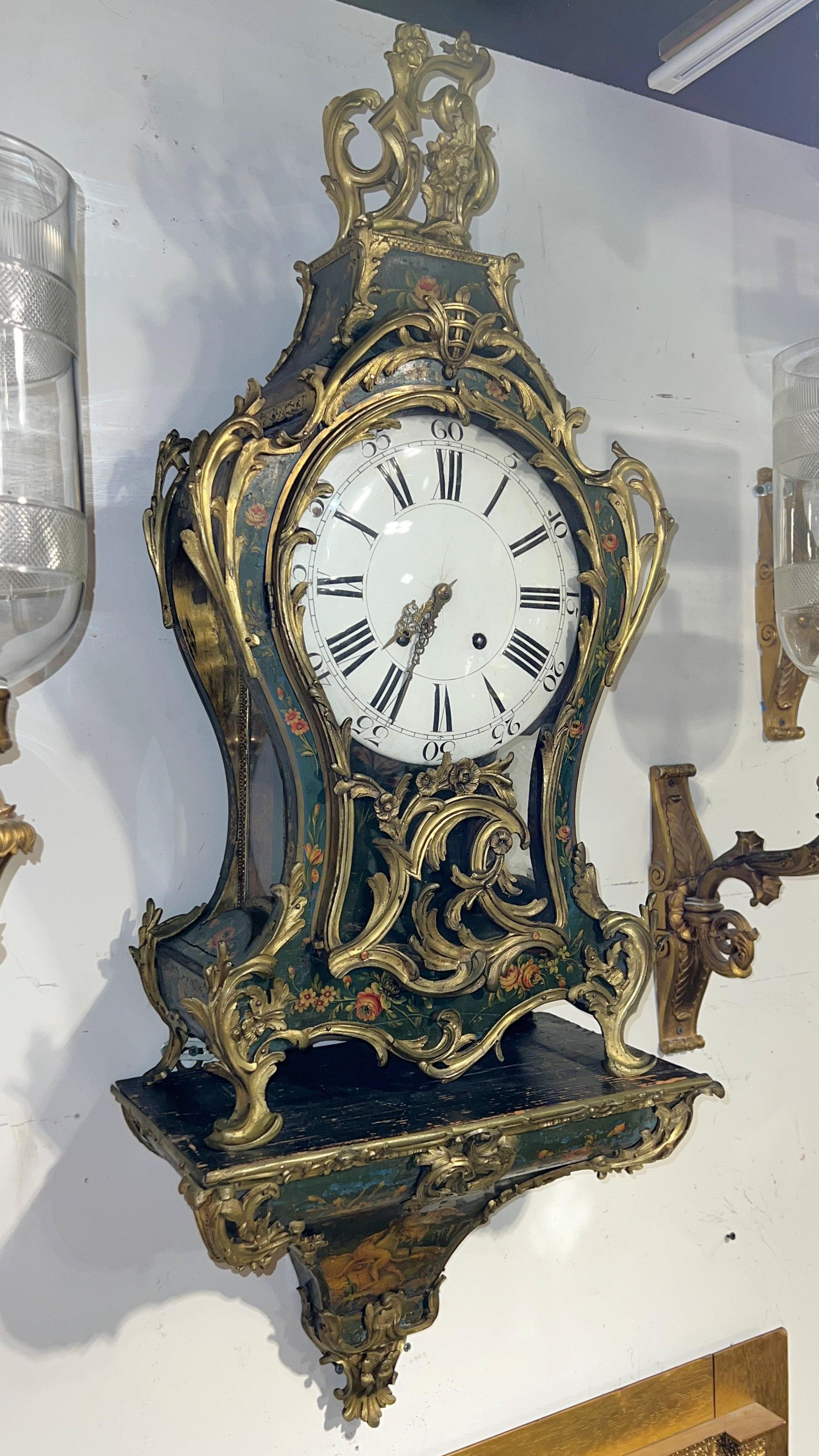 Large, antique French bracket clock in the Louis XV style with wooden case featuring finely painted floral designs and goose and hound at the base, on a green ground with well-cast gilt bronze mounts and original white porcelain face enameled with