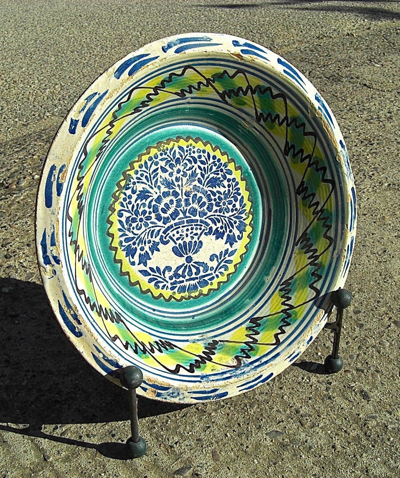 A lovely 19th century painted wash basin from the gypsy quarter of Triana in Seville, Spain.

Called 