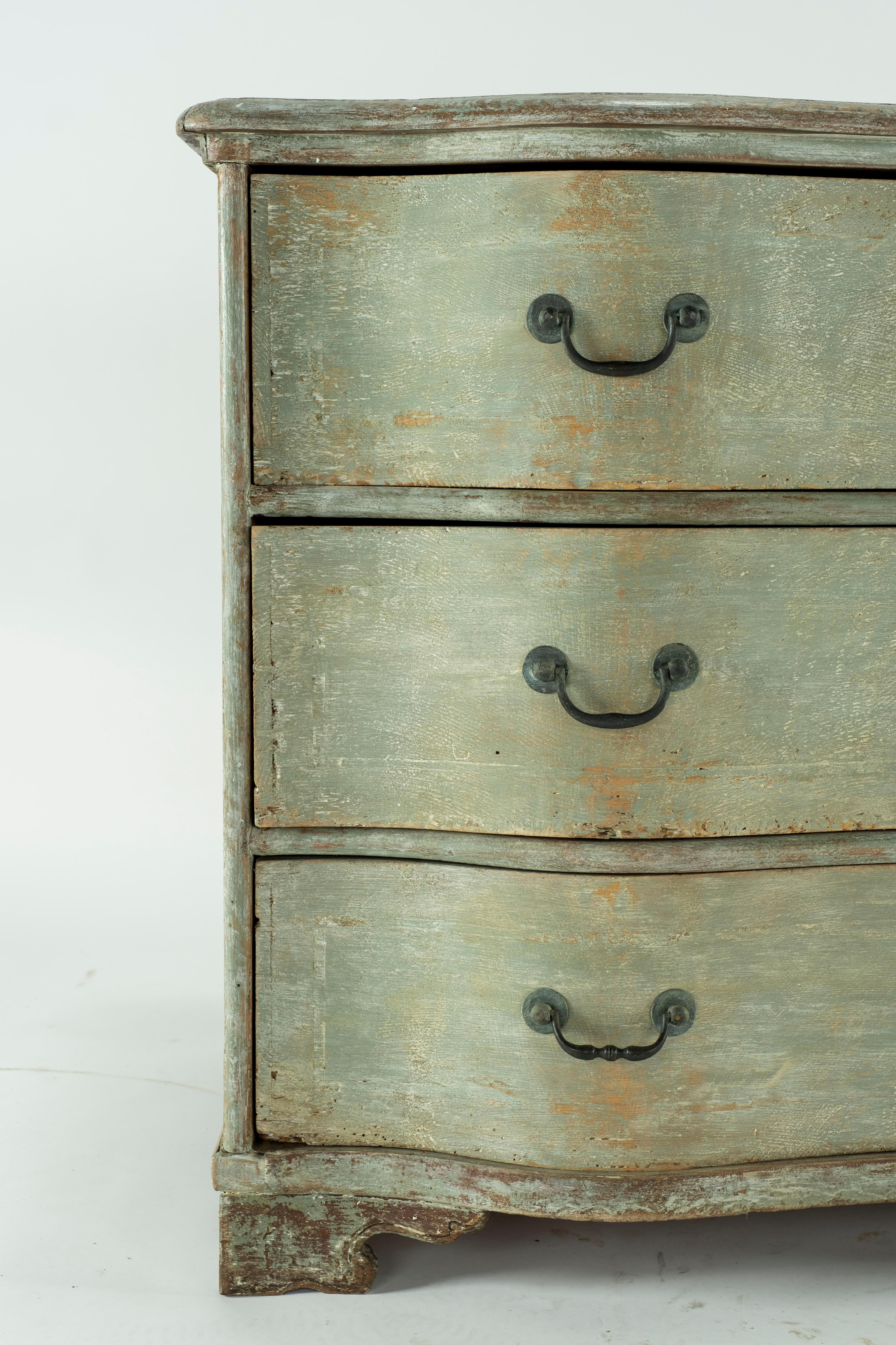 19th century painted Belgian chest with wavy top and 3 large drawers on bracket feet.