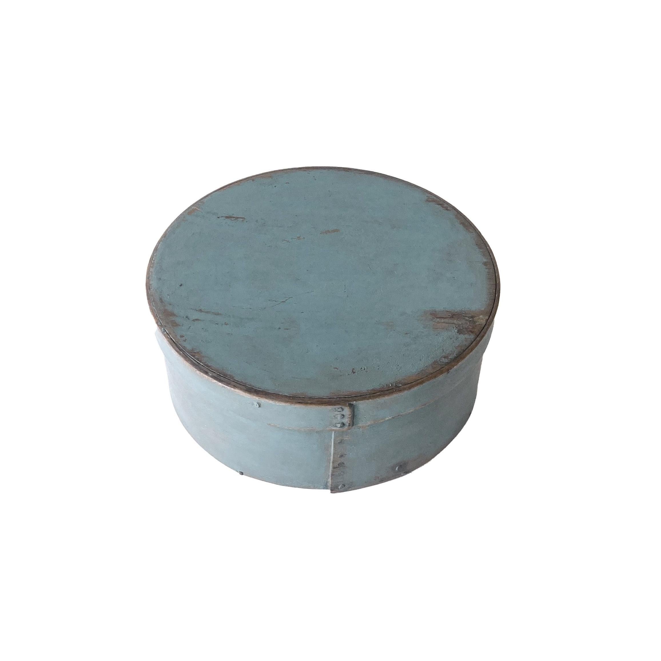 Round bentwood box made out of pine with lapped seams and iron 
tacks, retaining its original robin egg blue paint
Good condition with appropriate edge wear
American, circa 1850.