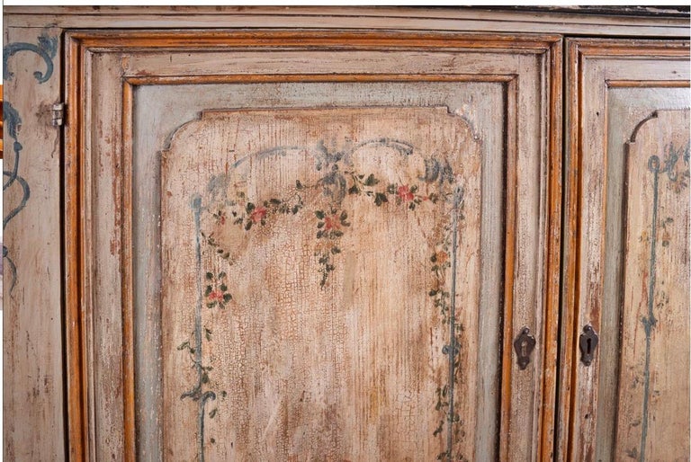 Colorfully Painted large 19th century French Buffet. The doors are beautifully decorated and there is a pair of unique corner doors.This piece has the original hardware and original shelving and would fit into any setting. It certainly would be